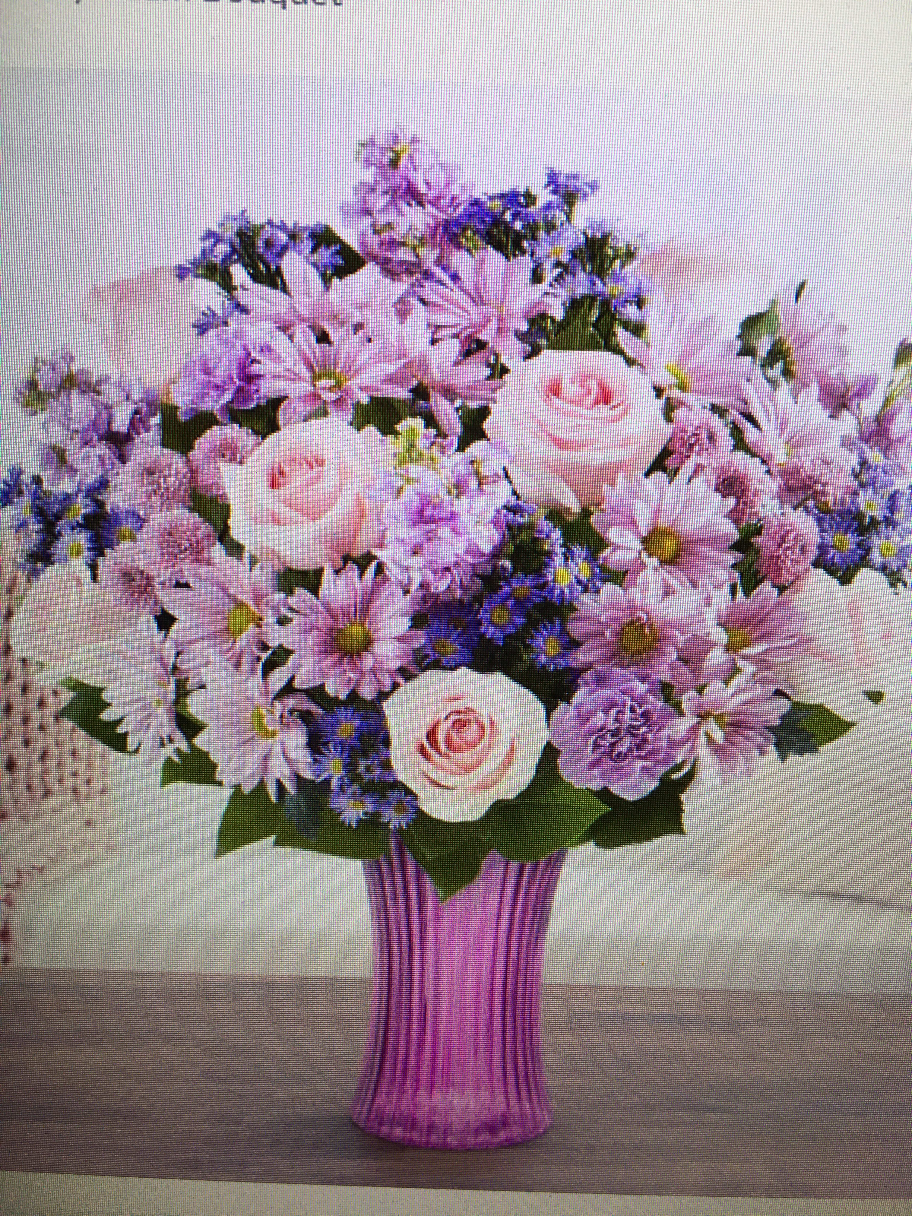 Daydream bouquet - Lilies carnations alstroemeria filler arranged in a purple vase