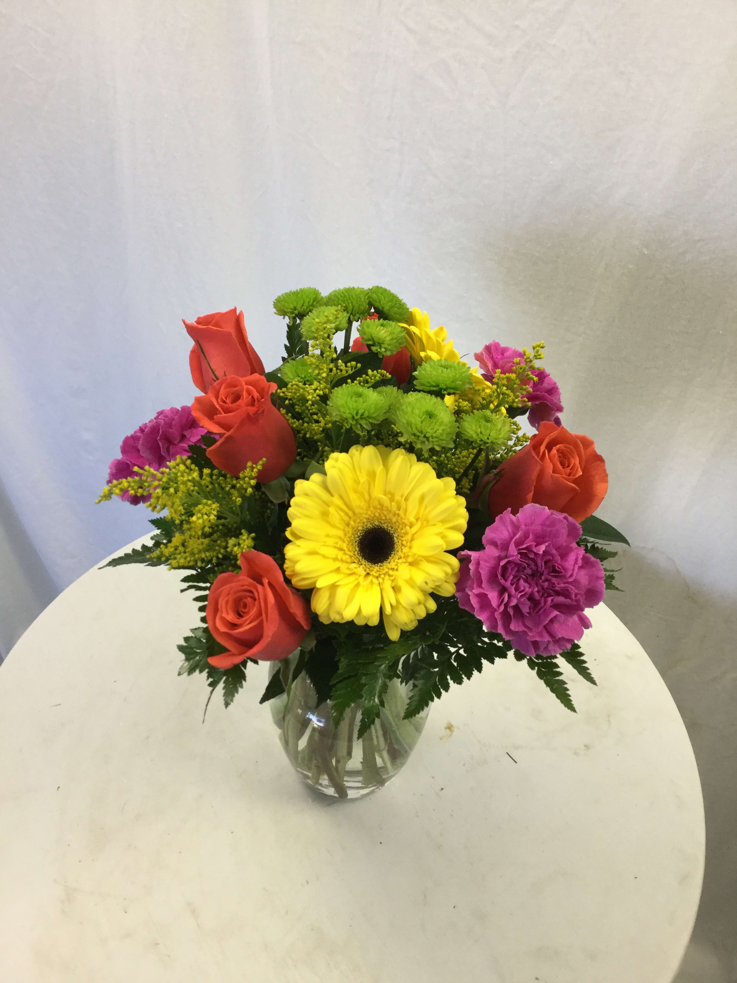 Bright and Beautiful Bouquet - This beautiful bouquet is full of bold color, fresh blooms, and fresh greenery. It makes for a wonderful gift for every special occasion!