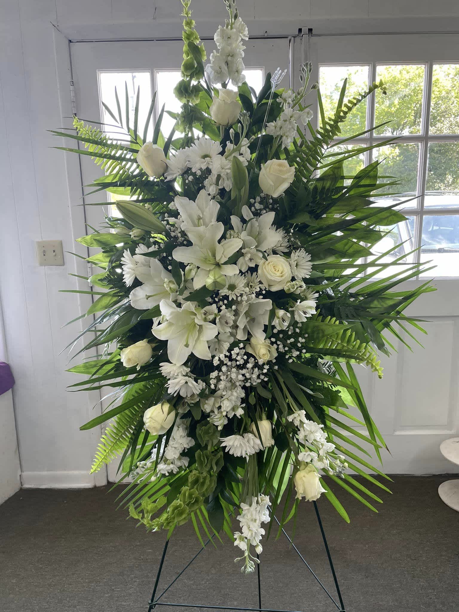 all white elegant standing spray - all white standing spray with roses lilies and bells of Irland