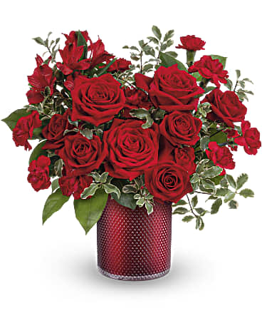 Radiantly Crimson Radiantly Crimson - This textured red cylinder vase has hearts delight of red roses, mini roses, and mini carnations. One sided, and abstract heart shaped