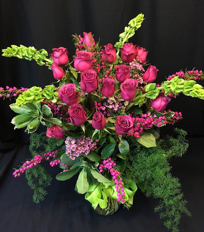 18 Long Stem Roses Plus with 2 Fillers - 18 roses premium roses plus additional tall flowers and 2 types of gorgeous filler flowers (which may vary in order to complement your rose color).  This is a very lovely Valentine or Mother's day unique rose arrangement of premium roses and accent flowers.*   Unfortunately we cannot guarantee a rose color with online orders.  Specify in the comments section any requests and we will try our best.