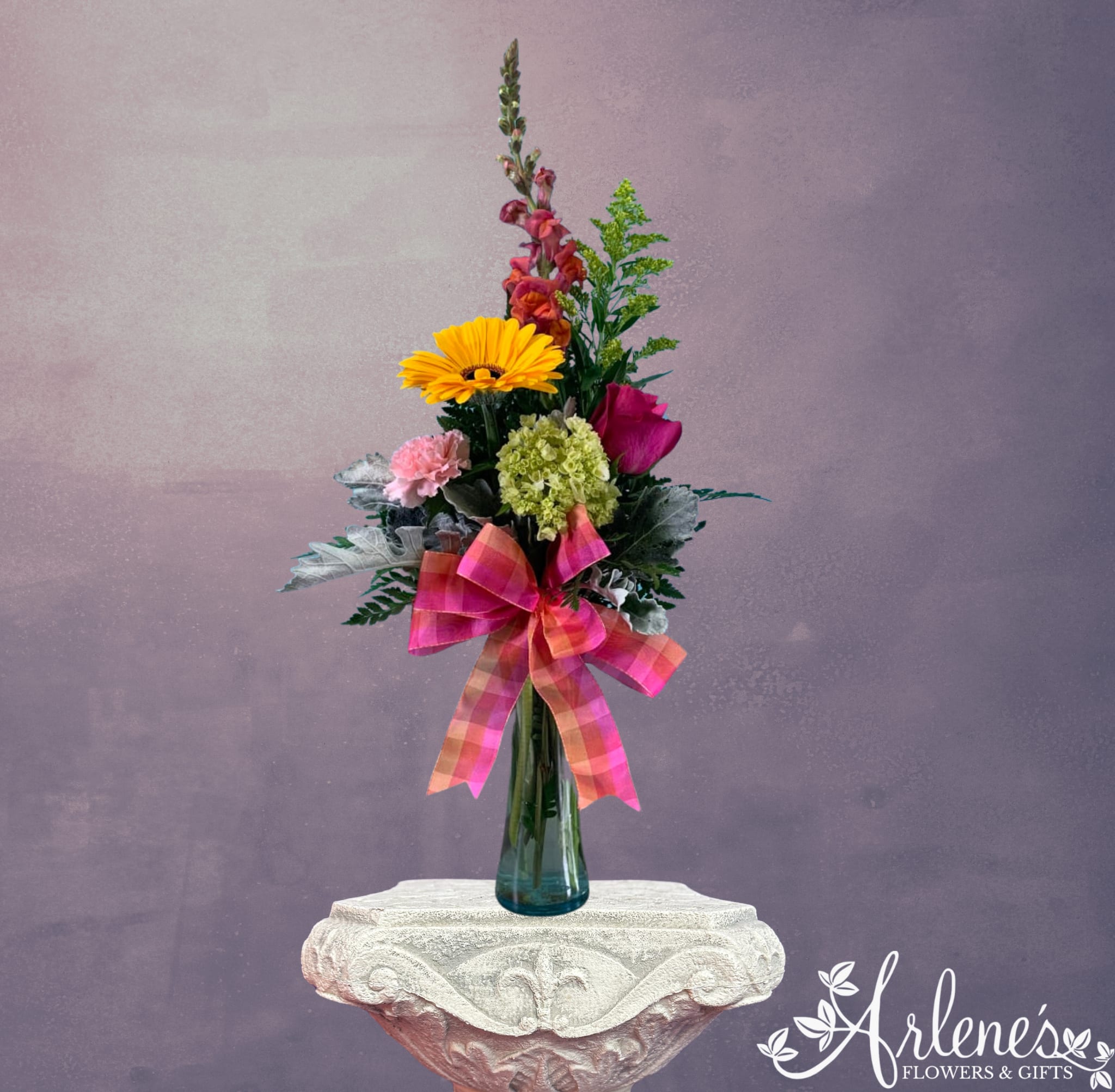 Token of Love - A sampler bouquet fit for that special mom in your life. This bouquet will have a small variety of spring stems paired with a colorful bow.