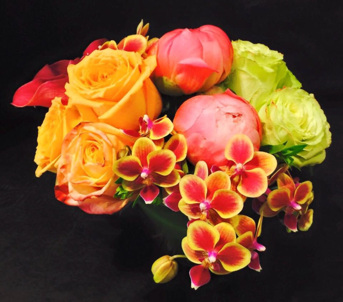 Non-conformist Nosegay Non-conformist Nosegay - Arrangement of oranges, reds, and whites.