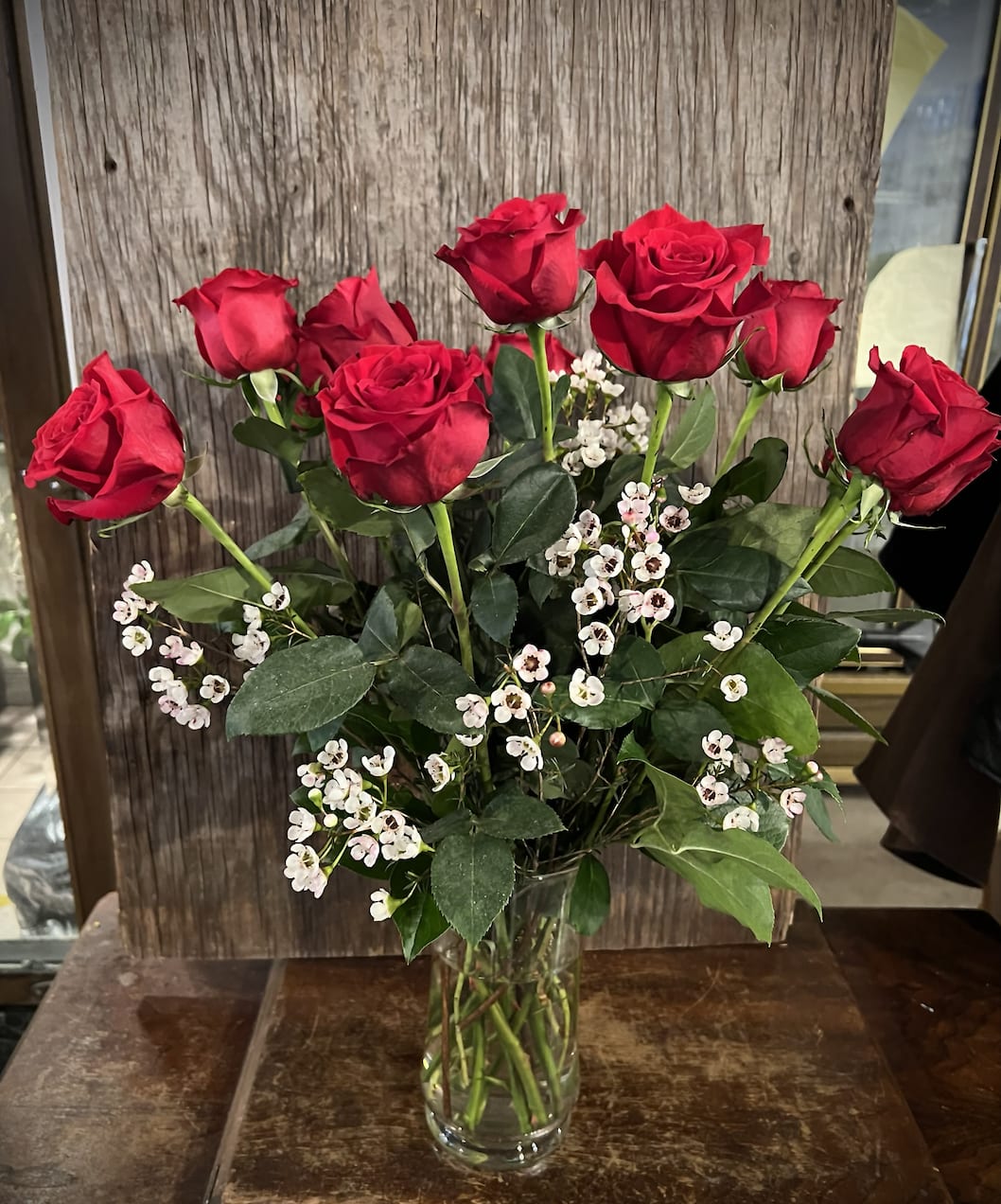 Dozen Red Roses Dozen Red Roses - One dozen of our red roses arranged in a clear glass vase with greenery. Not your 'everyday' dozen.