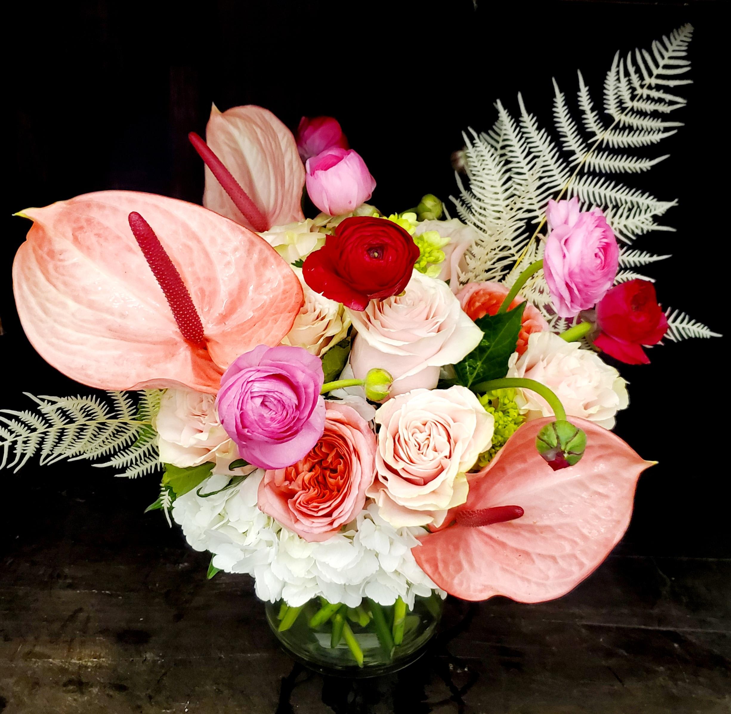 L-O-V-E L-O-V-E - Tell that special someone how much their love means to you with this sweet bouquet that has I love you written all over it! Blush Anthuriums, ranunculus, hydrangea, roses and more! Mother's day flower delivery in Fort Worth and surrounding areas.