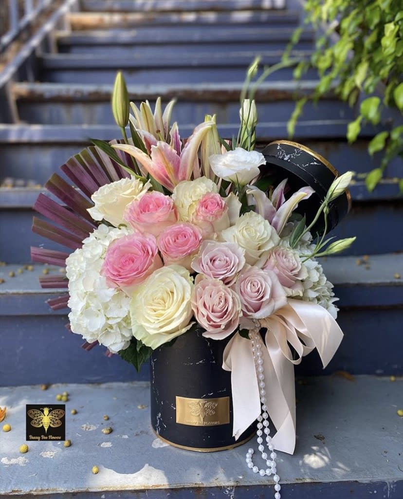 Ceramic Mix  - Mixed Flowers in our famous Ceramic Boxes! This beautiful arrangement is designed to deliver happiness to a loved ones day. Filled with beautiful flowers and customized to perfection, this arrangement is a showstopper! If you want to turn heads then this is the arrangement for you!
