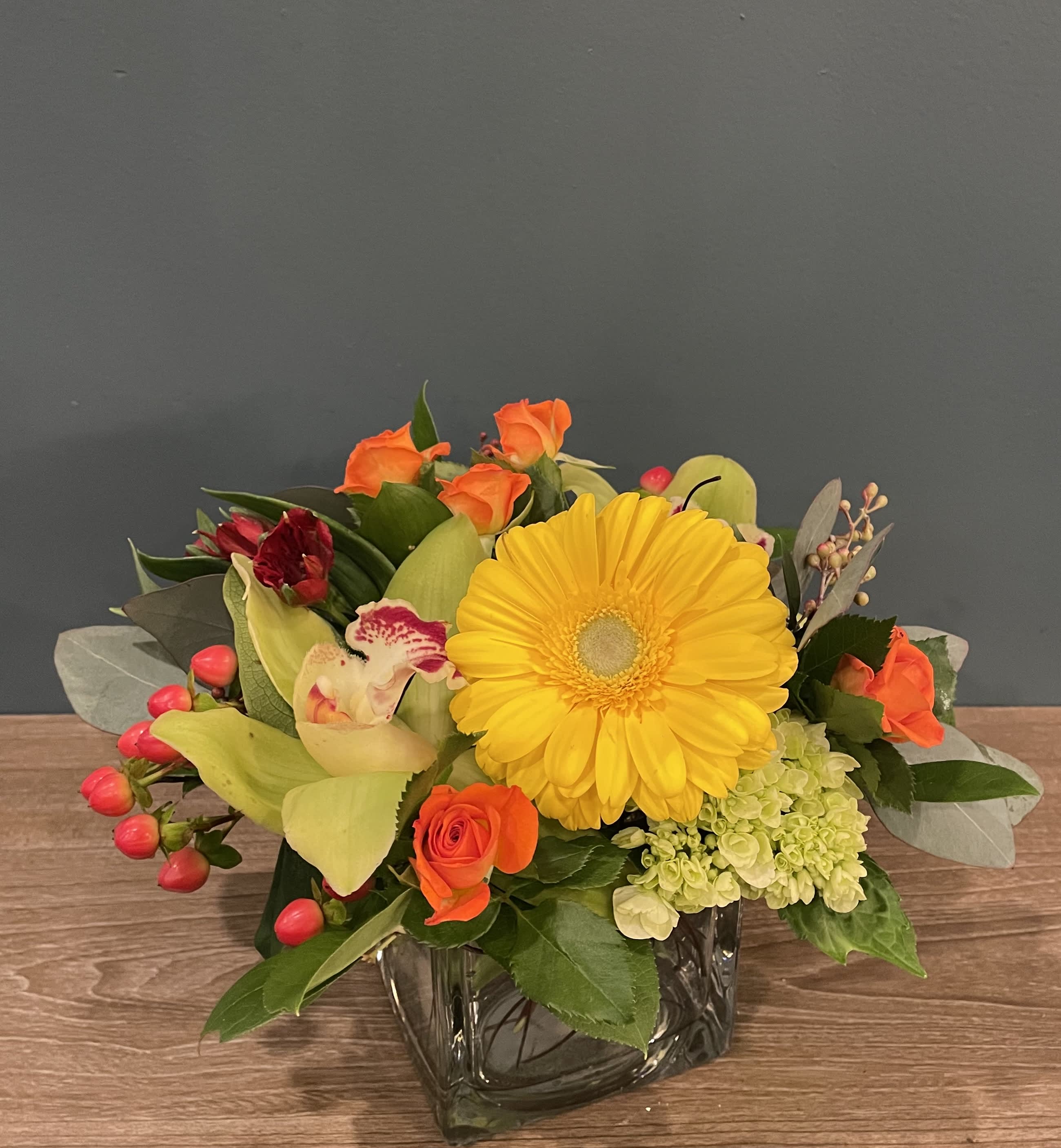Sunnyside Sunnyside - A bright mix of gerbera daisies, spray roses, alstroemeria and green cymbidium orchids. A great way to brighten someone's day. Approx. 11"H x 10"W