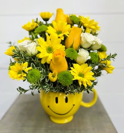 A Smile On Your Face Bouquet - Put a smile on their face - and in their heart - with this happy as can be bouquet! Hand-delivered in a food safe mug for years of satisfied sipping this cheerful gift of roses and mums spreads happiness wherever it goes.  T600-1A