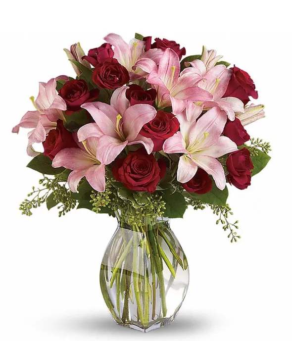 lavi valen - your loved one with luxuriant reds and pinks. A romantic anniversary gift or sumptuous surprise, it stars fragrant pink asiatic lilies and rich red roses for a feminine twist on the classic rose bouquet. The Lavish Love Bouquet is the perfect luxury Valentine's Day bouquet.