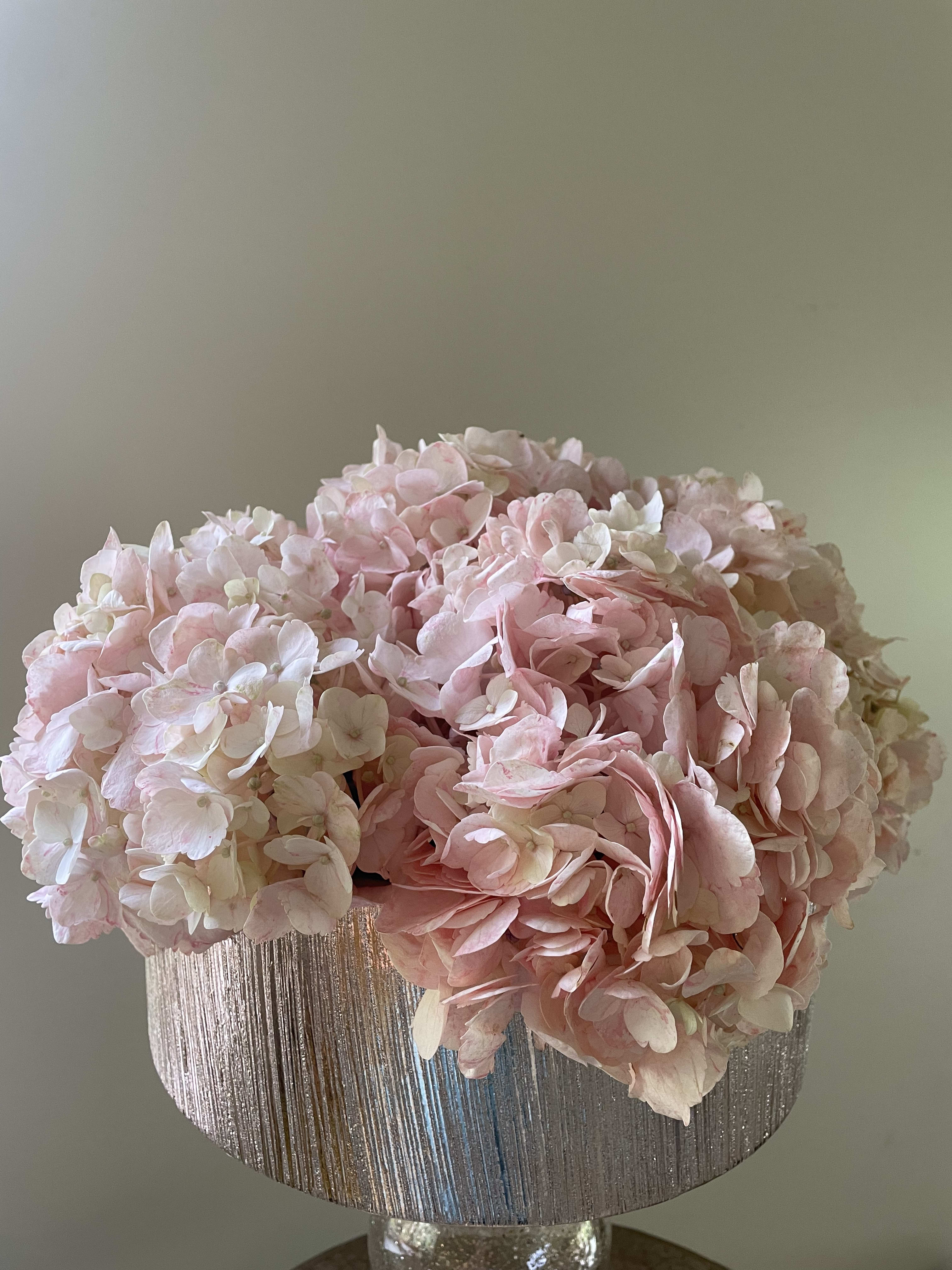 Blush - Peach hydrangeas and a rose gold ceramic vase.