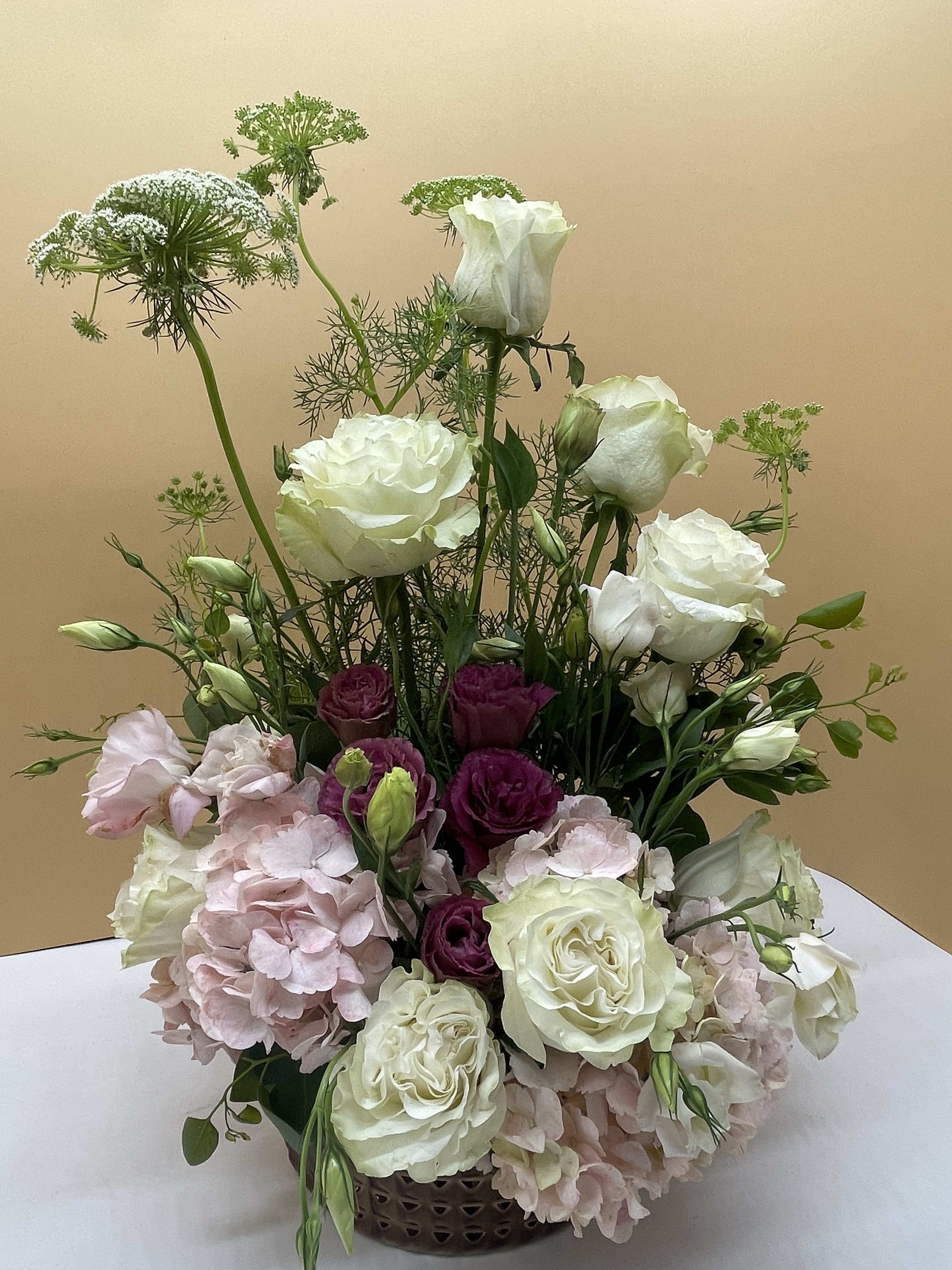 Peach & Cream Peach & Cream - Beautifully arranged peach hydrangeas, roses, with purple lisianthus and queen Ann’s lace.