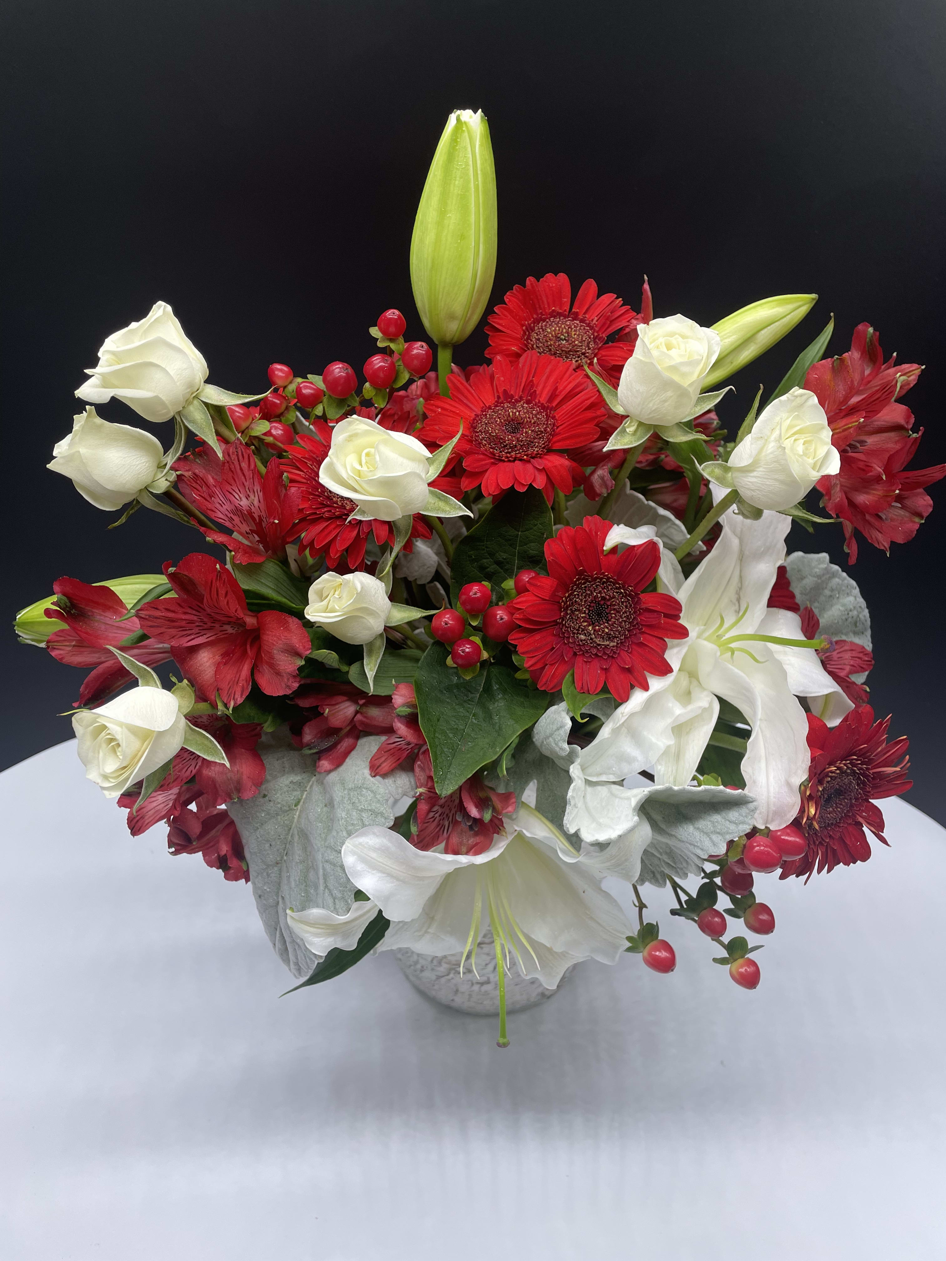 For this season - Casablanca lilies, Gerbera daisies, white roses, alstromeria