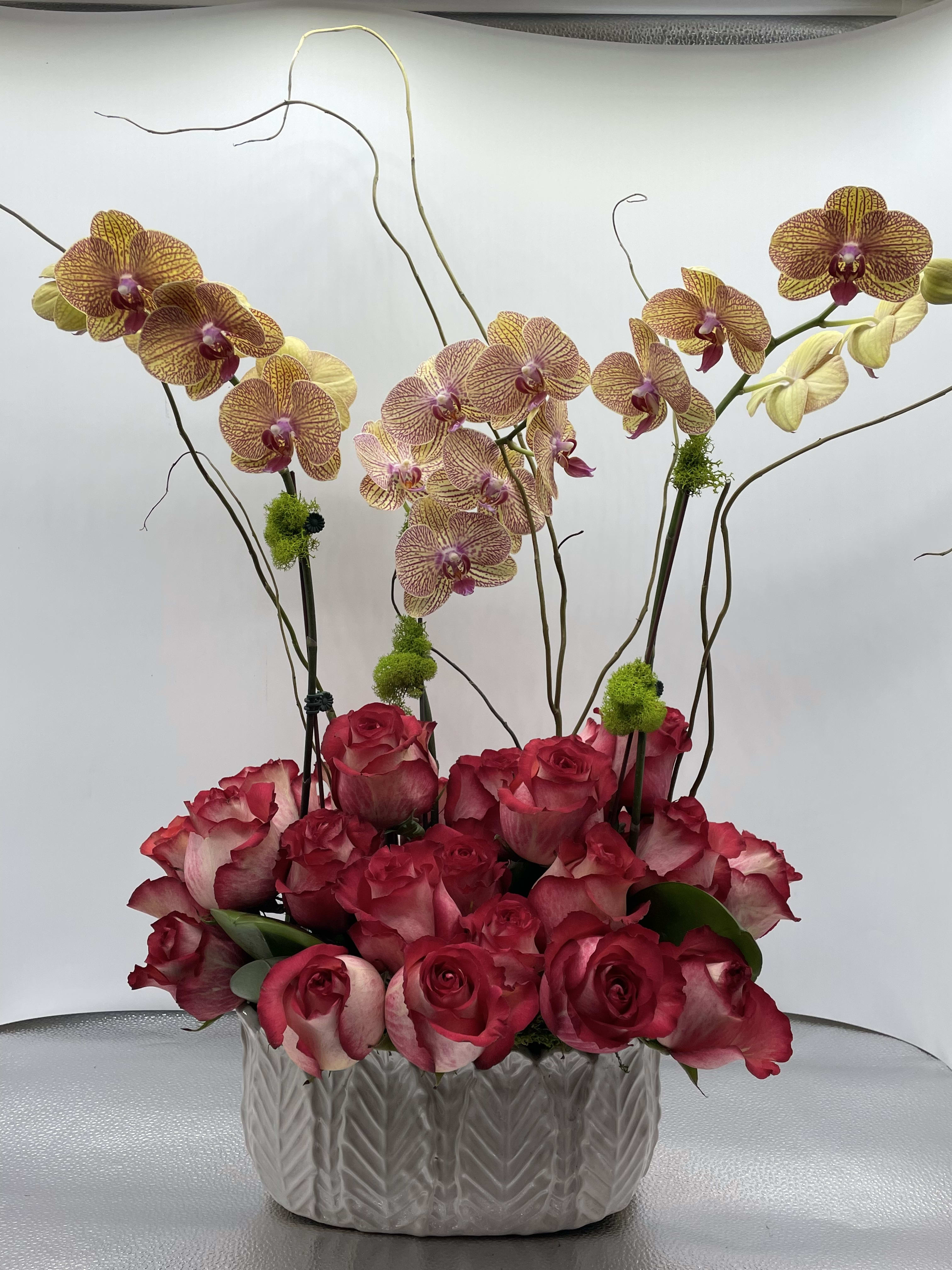 Crimson Peach - Phalaenopsis orchids and roses.