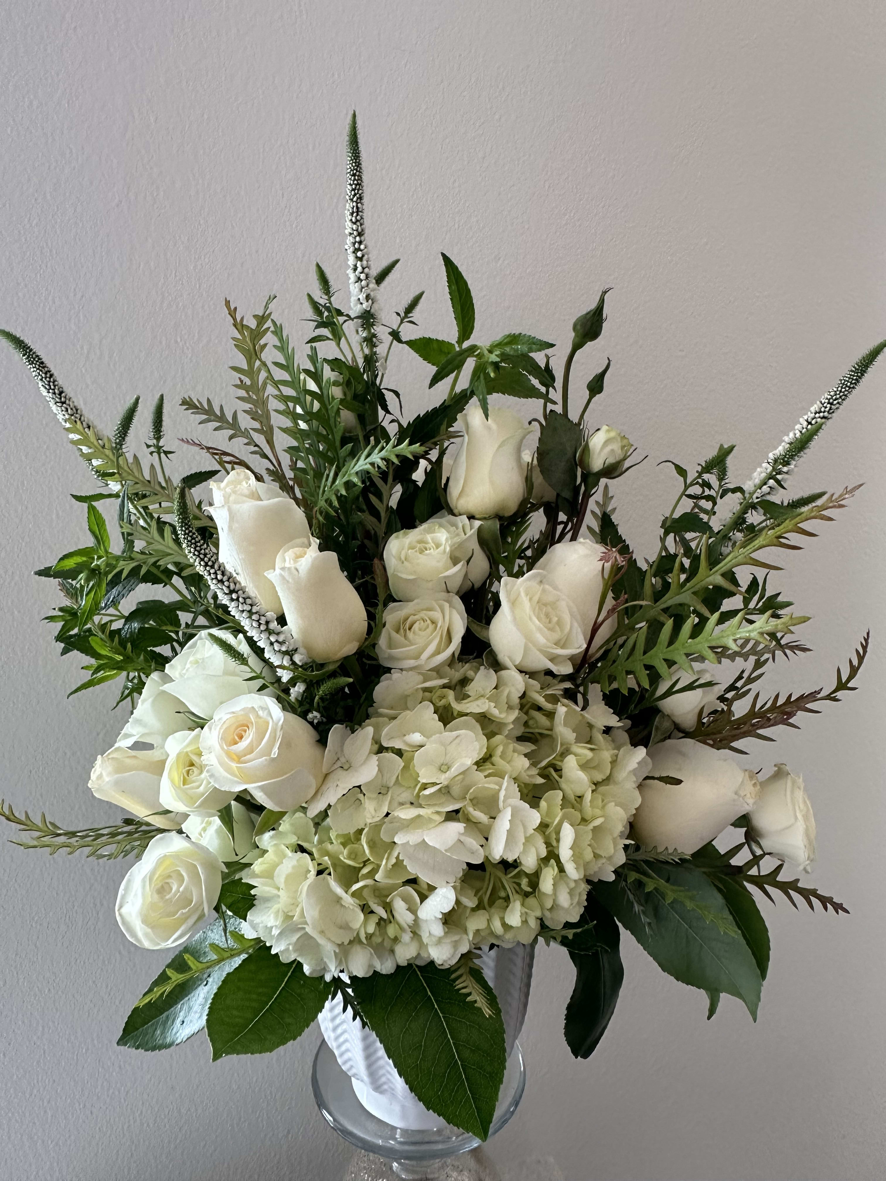 Simplicity Simplicity - An elegant combination of roses, hydrangeas and Veronica mixed with greenery to let that special someone know that you’re thinking about them.
