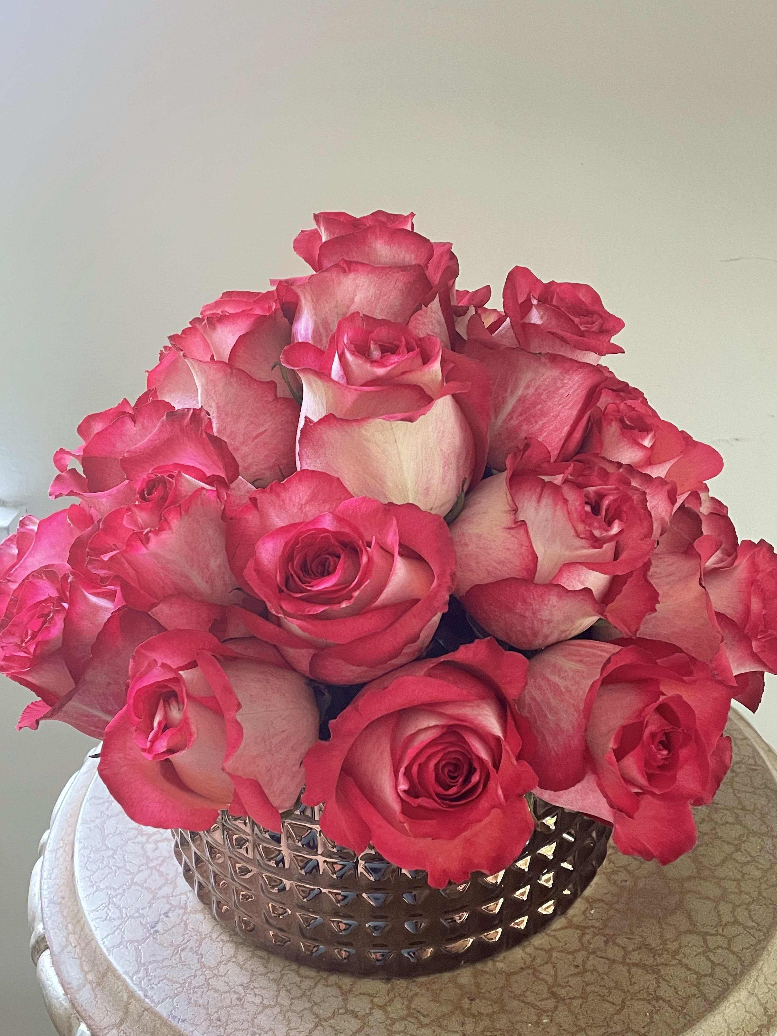 Double Delight - Two dozen extra large roses in a dark rose gold ceramic vase. 