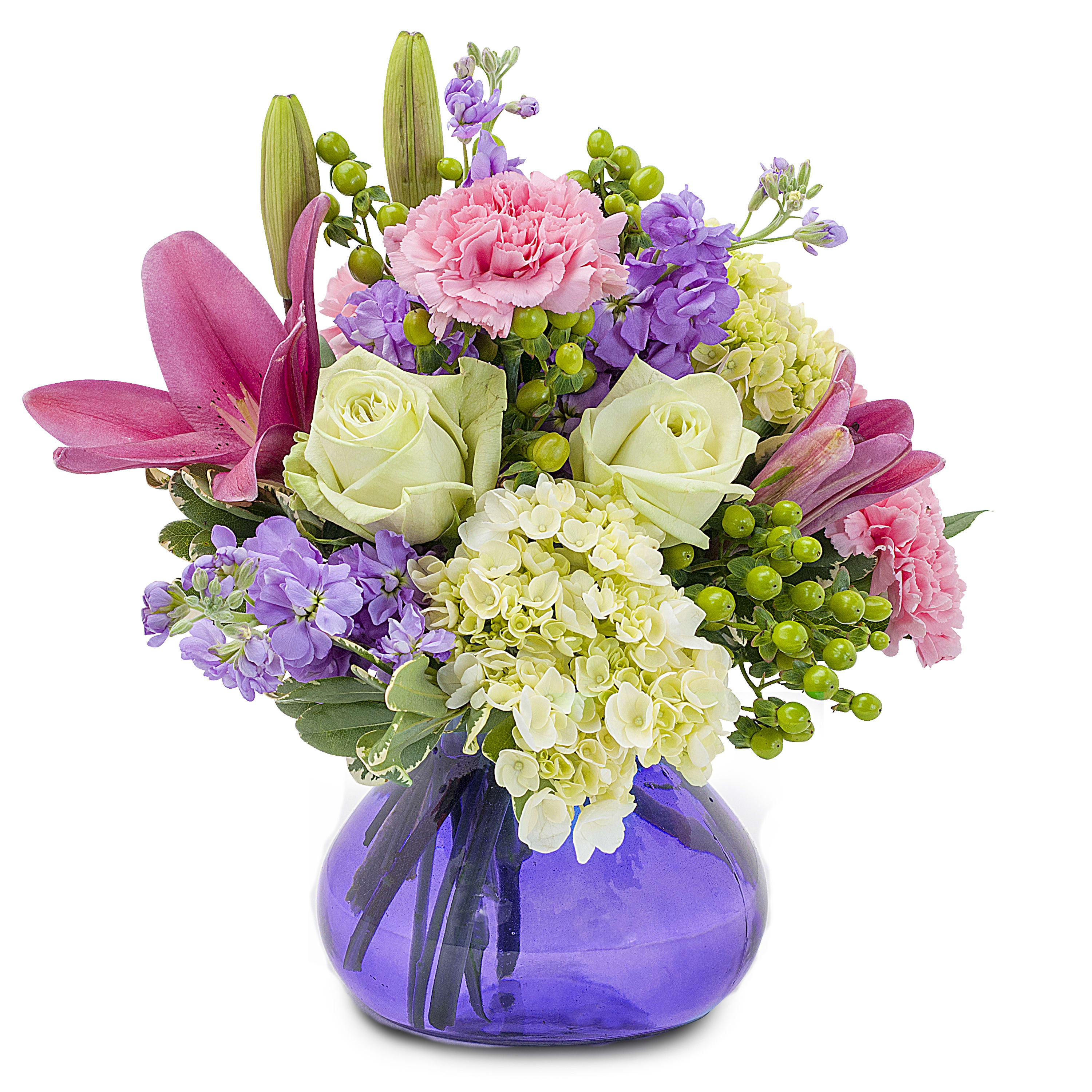 Embrace TMF-566 - A beautiful combination of pink, lavender and green blooms in a purple vase.	Approximately 10&quot; wide by 10&quot; high