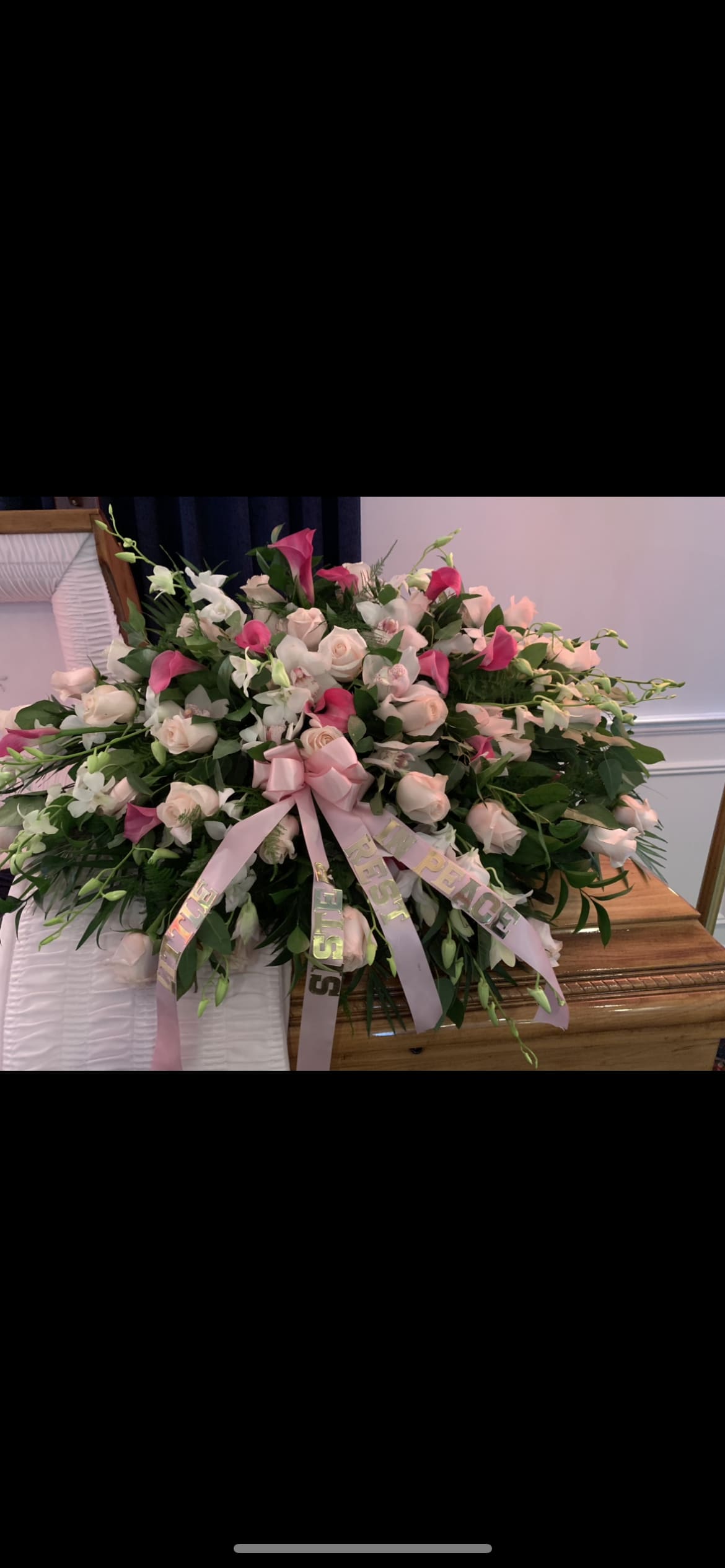Casket spray light pink and white  - Casket spray with blush pink roses, pink calla lillies, two types of white orchids. Finished with premium greens  