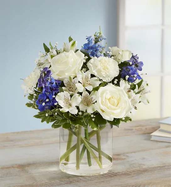 Blue &amp; white wishes - Blue delphinuium, white roses, white carns, white Astro, baby’ breath, and greenery