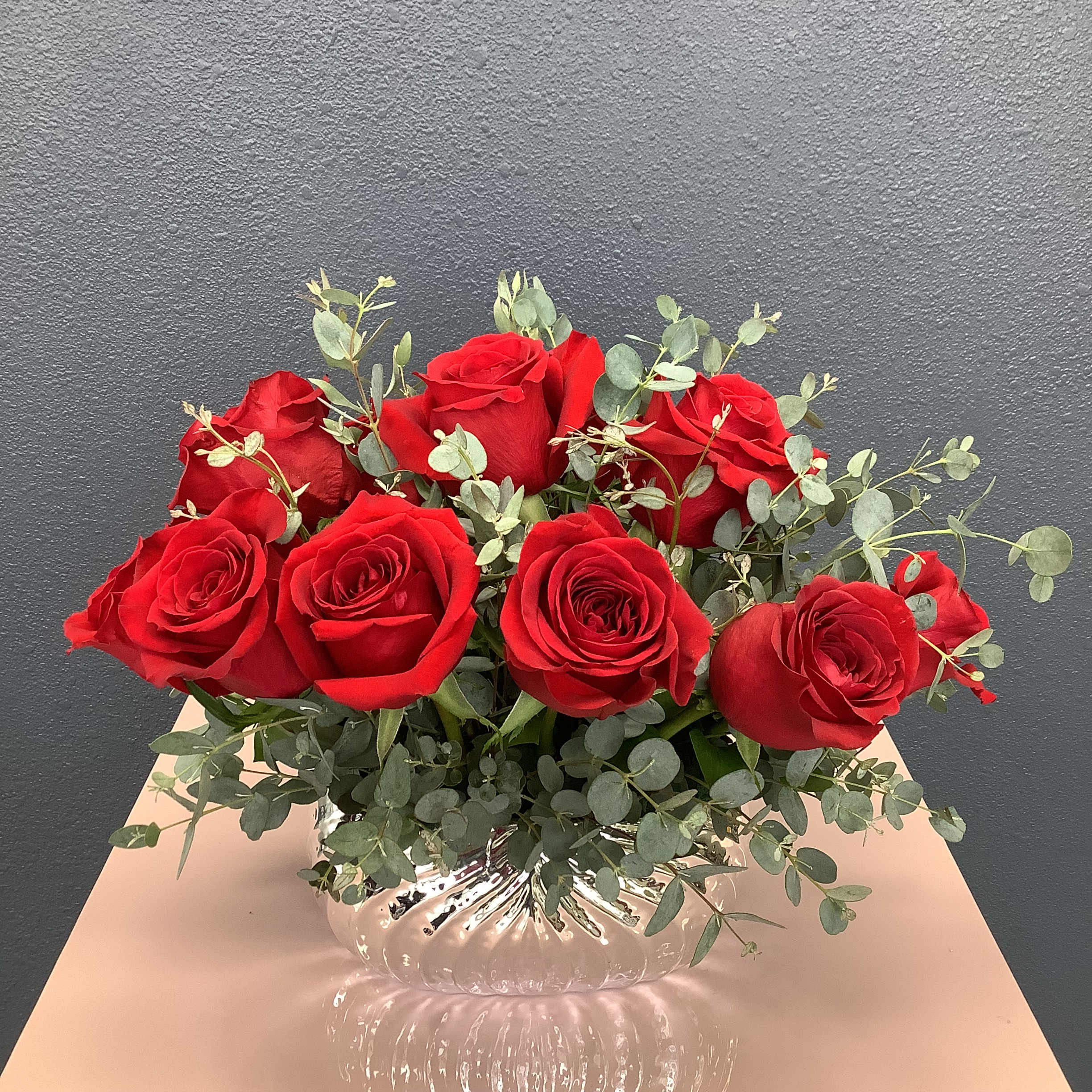 Amour - A classic display of 12 deep red roses in a beautiful ceramic vase, Classic and for any occasions. 