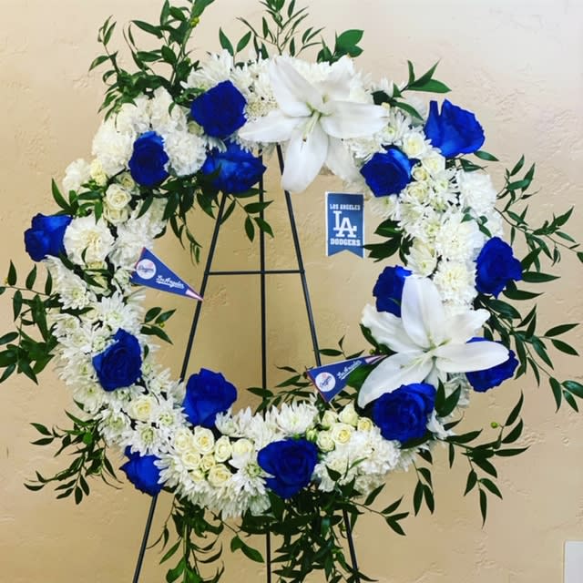 Sports Sympathy Tribute Wreath - Customized to your loved one's and their favorite team Sports Sympathy Tribute Wreath - Customized to your loved one's and their favorite team - We specialize in incorporating any sports theme or personal preference into a custom funeral wreath design, creating a meaningful tribute. At this difficult time, our custom-made funeral wreaths are tailored to honor your loved one uniquely. Kindly share your color preferences and any details in the florist comments. If you're uncertain or have questions, feel free to call us at 602-675-3110 or text at 602-319-0104. We're here to guide and assist you through the design process. Check our samples in the attached pictures.