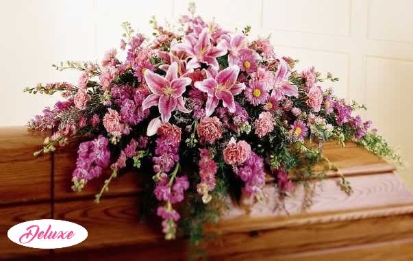 Remembrance Casket Spray Remembrance Casket Spray - Stargazer lilies are combined with daisies, stock, carnations and more to create this elegant casket display.