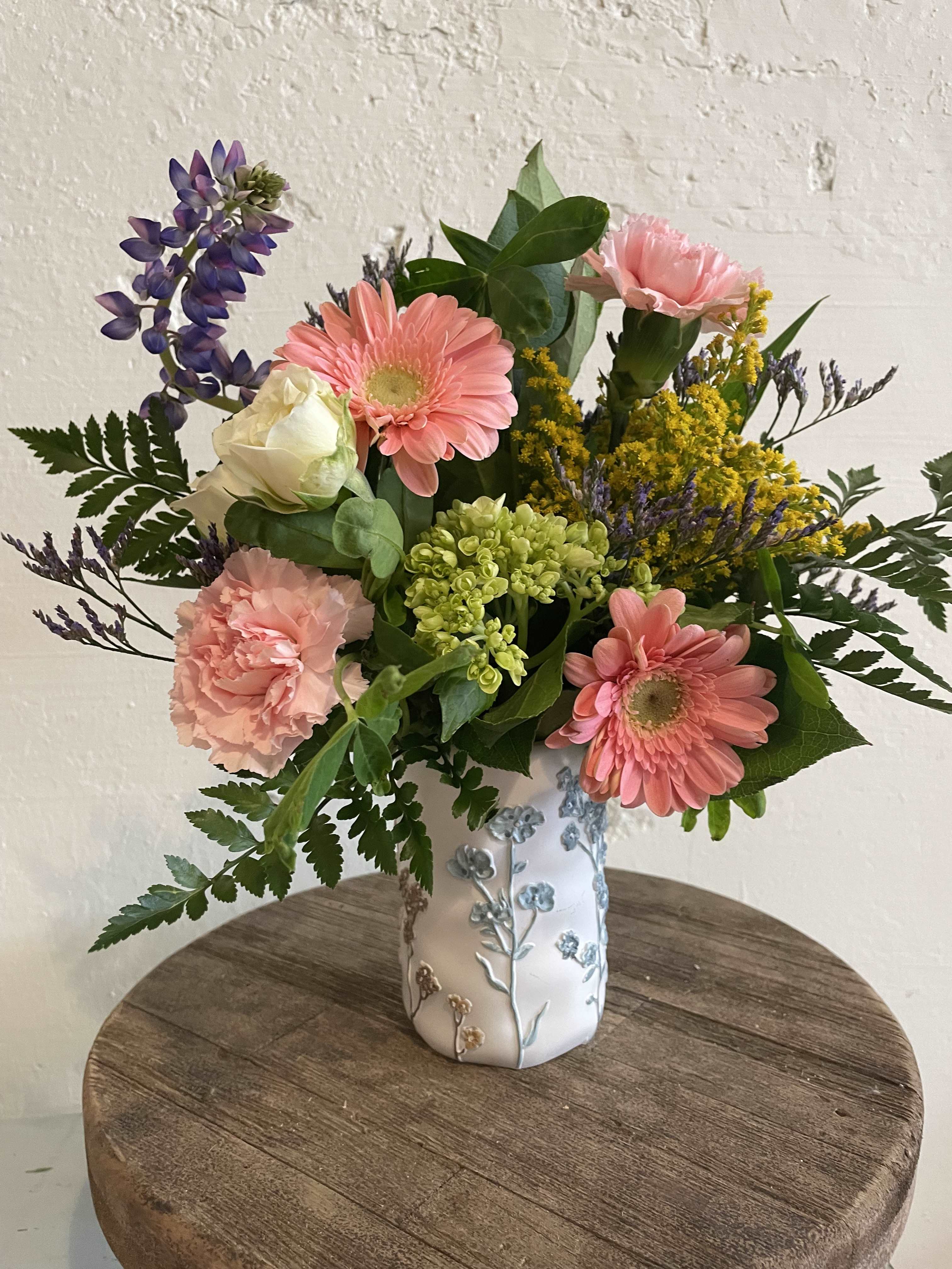 Vintage Posey - Such a beautiful container featuring wildflowers! Our product offerings are subject to change based on seasonal availability. We prioritize delivering high-quality designs that are also cost-effective. To achieve this, we collaborate with a farm in Stillwater, OK, and use locally sourced flowers that are in season. PlEASE NOTE THAT THE DESIGNS WILL DIFFER from the images depicted, but our commitment to delivering superior quality designs at an affordable price remains constant.  If you're a member, don't forget to use your discount code during check out. If you're not yet a member, please contact us to join and receive a 10% discount on all orders.