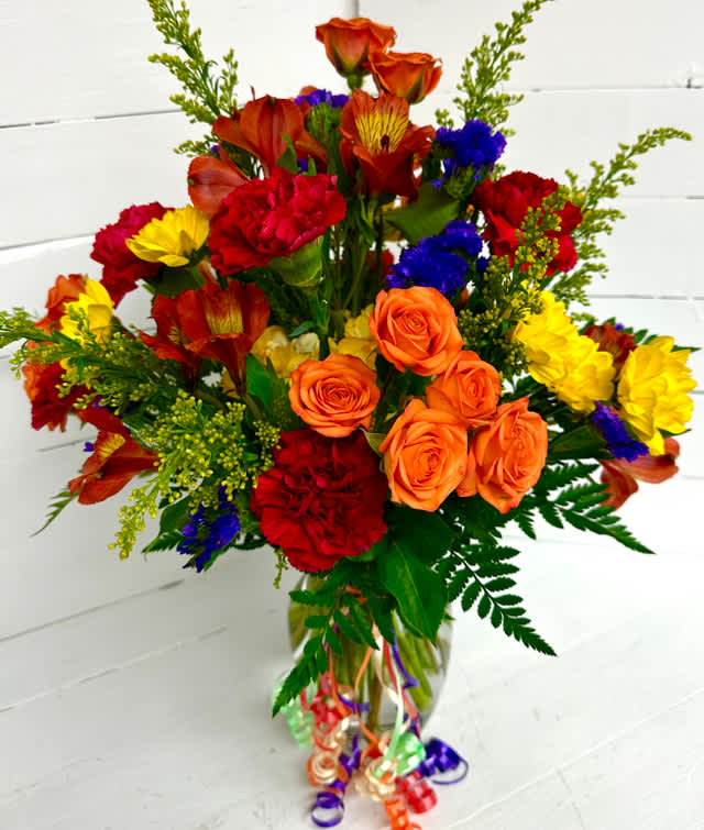 HBD 2U - This bright and beautiful birthday bouquet of flowers is sure to make the recipient smile! The vibrant arrangement features an array of colorful blooms in a clear vase, accented with shimmering streamers for a festive touch. This thoughtful gift is the perfect way to wish someone a happy birthday.