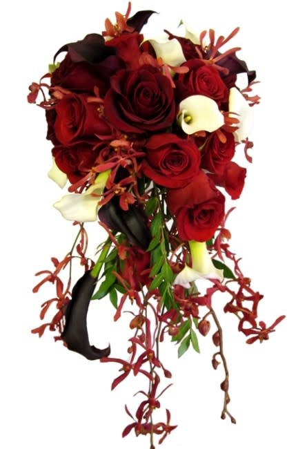 Cascade Bridal Bouquet - This was a custom cascade bridal bouquet that we have created for one of our brides. Colors were maroon with light and dark red. We used Ecuadorian Roses, Mini Calla Lilies and James Storie Orchids. All of these blooms are available in different colors and we can make a custom bouquet just for you.  Smaller bridesmaid bouquets are also available.  All of our bridal bouquets are custom made and we can always customize them to meet your needs. Order your bridal bouquet online or come in for a wedding consultation (by appointment) and let us design a bouquet of your dreams. Contact us online or call 619-237-8842 today.