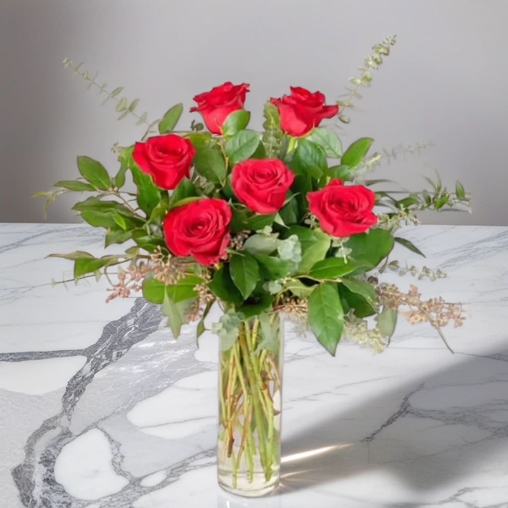 Classic Half Dozen - Our Classic Half Dozen is six red roses designed in a tall glass cylinder vase accented with fragrant eucalyptus. This is the gift they’re sure to cherish!  Great for Valentine’s Day, Mother’s Day, anniversary, birthday, or any occasion!   For the best flower delivery in East Moline, Moline, Silvis, Hampton, Carbon Cliff, and all the surrounding Quad Cities give Hignight Florist place your order now!   