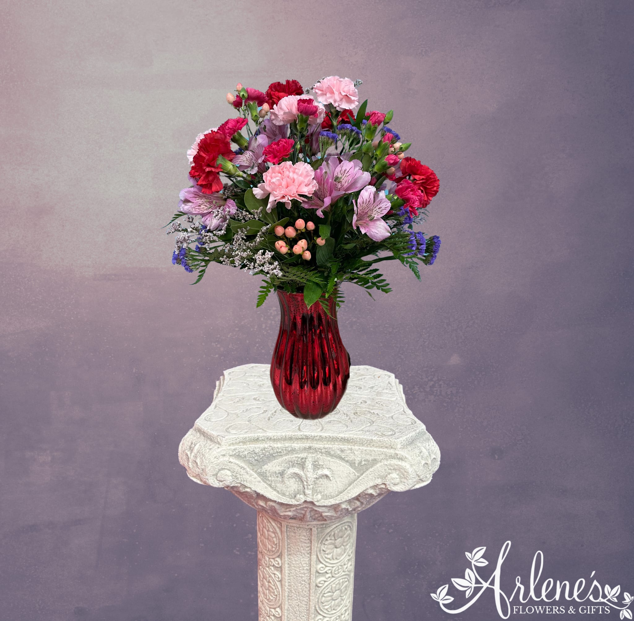 Everlasting Beauty Bouquet - A romantic bouquet with flowers that will last longer than a Hollywood marriage. A mix of red, pink and white carnations, Alstromeria and hypericum berries. 