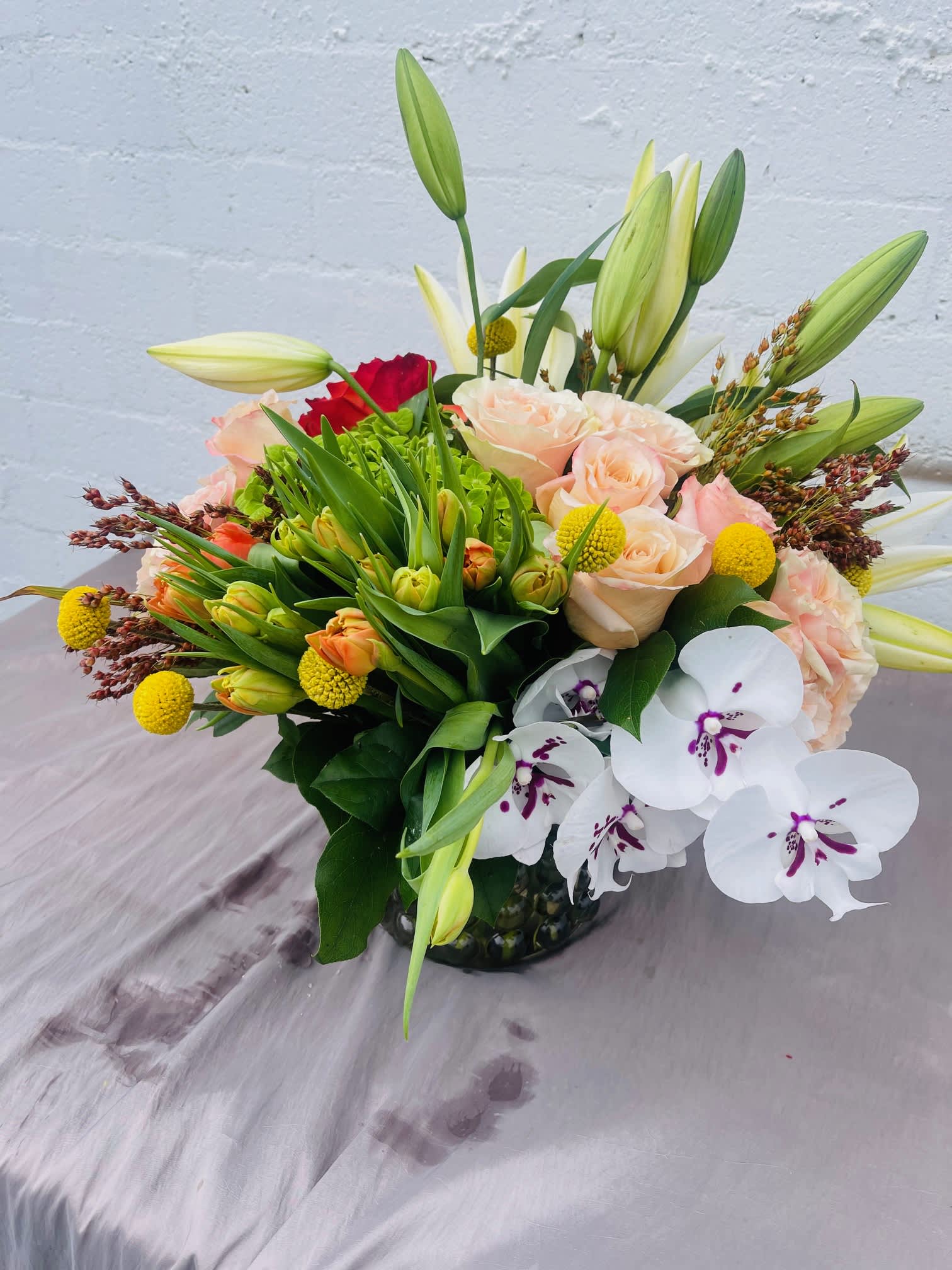 Peach, Yellow afternoon dust Peach, Yellow afternoon dust - European style with lush double tulips garden roses and orchids.