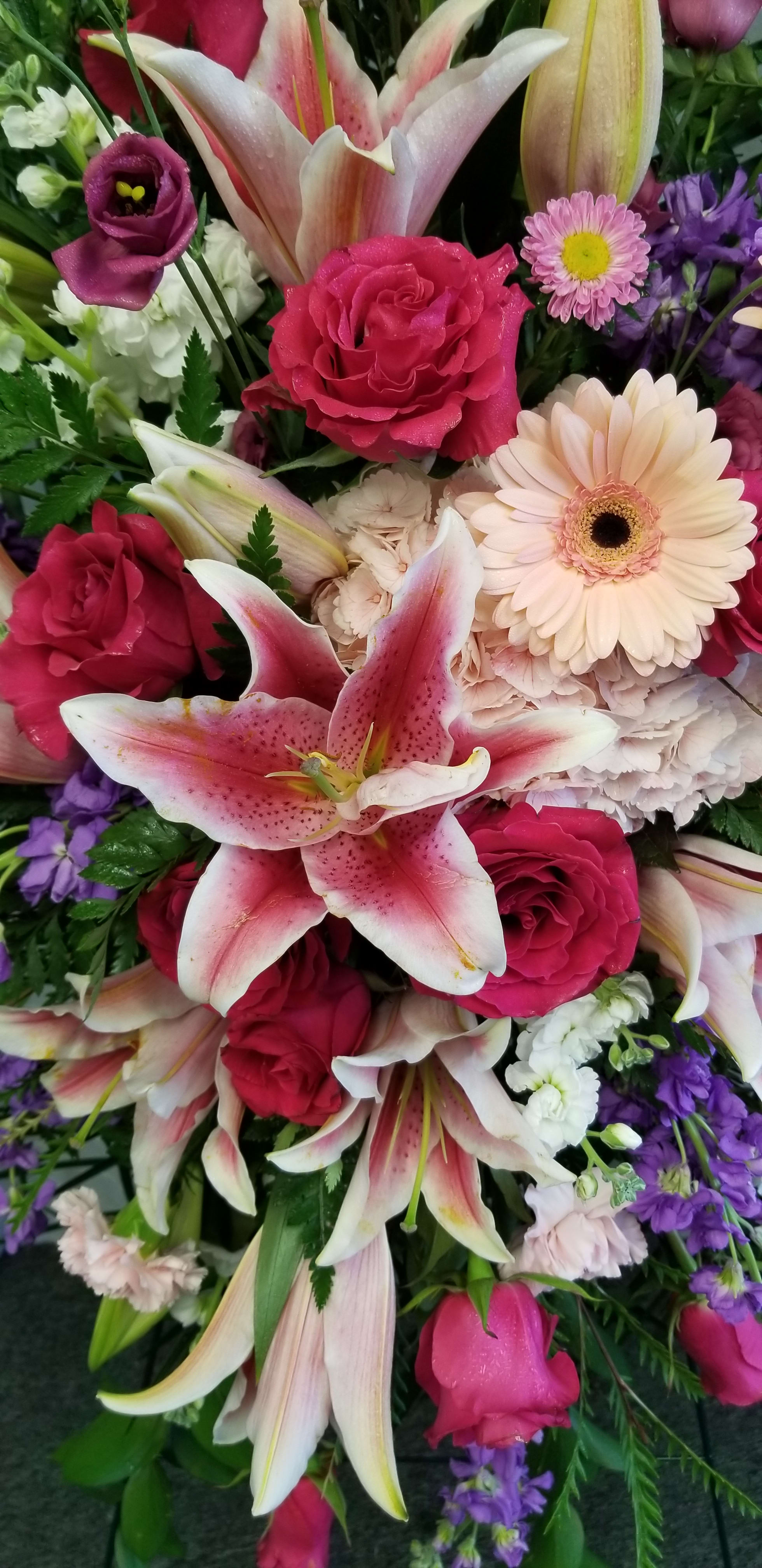 Premium Designer's Choice - Our talented designer's will create a beautiful arrangement using premium specialty flowers.   Flowers pictured are just an example of what the designer may choose to use in the arrangement.  You may indicate any special requests or colors in the special instruction area.  