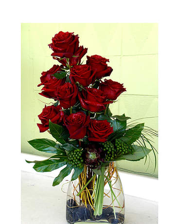Burning Love - Red Roses Burning Love - Red Roses - Elevate your Valentine's Day with a timeless expression of love from your trusted florist in Los Angeles, florist in Santa Monica, florist in Hollywood, florist in Pasadena, florist in Beverly Hills, and florist in West Hollywood. Our exquisite arrangement features a dozen red roses, the traditional symbol of love, with a modern twist, stylishly presented in a contemporary glass vase. With our convenient flower delivery in Los Angeles, flower delivery in Santa Monica, flower delivery in Hollywood, flower delivery in Pasadena, flower delivery in Beverly Hills, and flower delivery in West Hollywood, you can easily surprise your special someone with this elegant gift. Order now to make their Valentine's Day truly memorable!