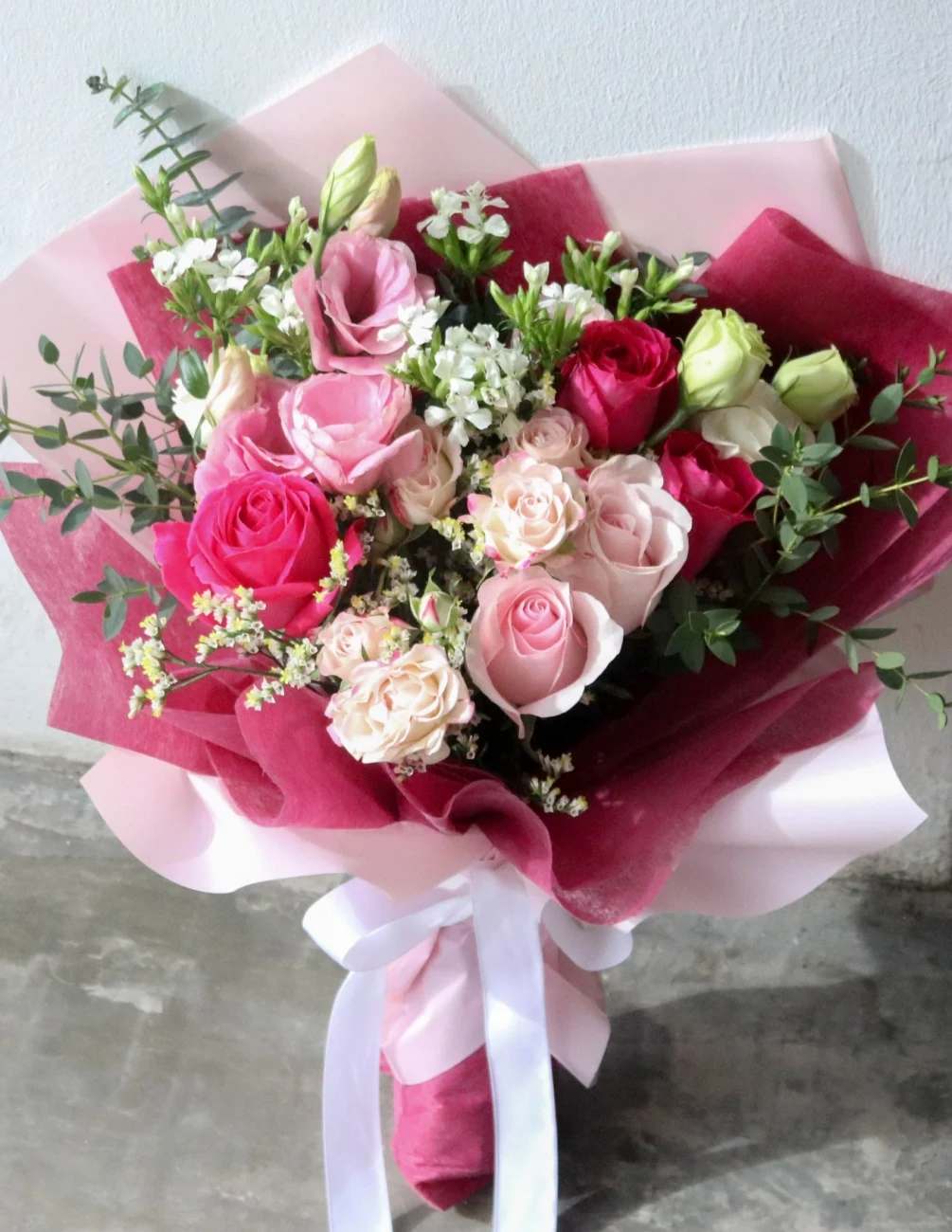 Hand Wrapped - VALENTINE'S DAY PINK MIX Designer Choice - Designer's Choice - A romantic mix of florist choice of fresh flowers, beautifully wrapped up in our classic Craft paper with a ribbon appropriate to the occasion. Bouquet does NOT come in a vase and picture is for sample purposes only. Each bouquet will be a unique of its kind.