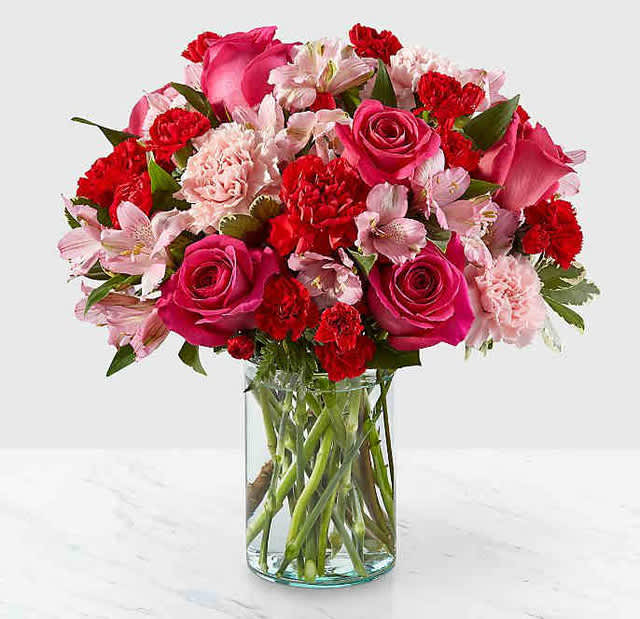 You're Precious Bouquet - YOU'RE PRECIOUS BOUQUET Blushing shades of pink blooms are nestled in lush greens to charm anyone's day. This bouquet is abundant with a classic assortment of pretty florals – roses, alstroemeria and carnations to name a few.