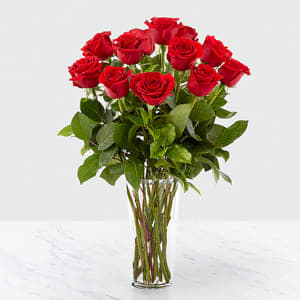 Long Stem Red Rose Bouquet Long Stem Red Rose Bouquet - "Nothing speaks of love so much as a bouquet of beautiful long stem red roses. Arranged in a classic glass vase, this bouquet is a gift to her heart from yours. GOOD bouquet is approx. 24""H x 16""W. BETTER bouquet is approx. 24""H x 18""W. BEST bouquet is approx. 24""H x 18""W. BETTER bouquet is approx. 25""H x 21""W. "