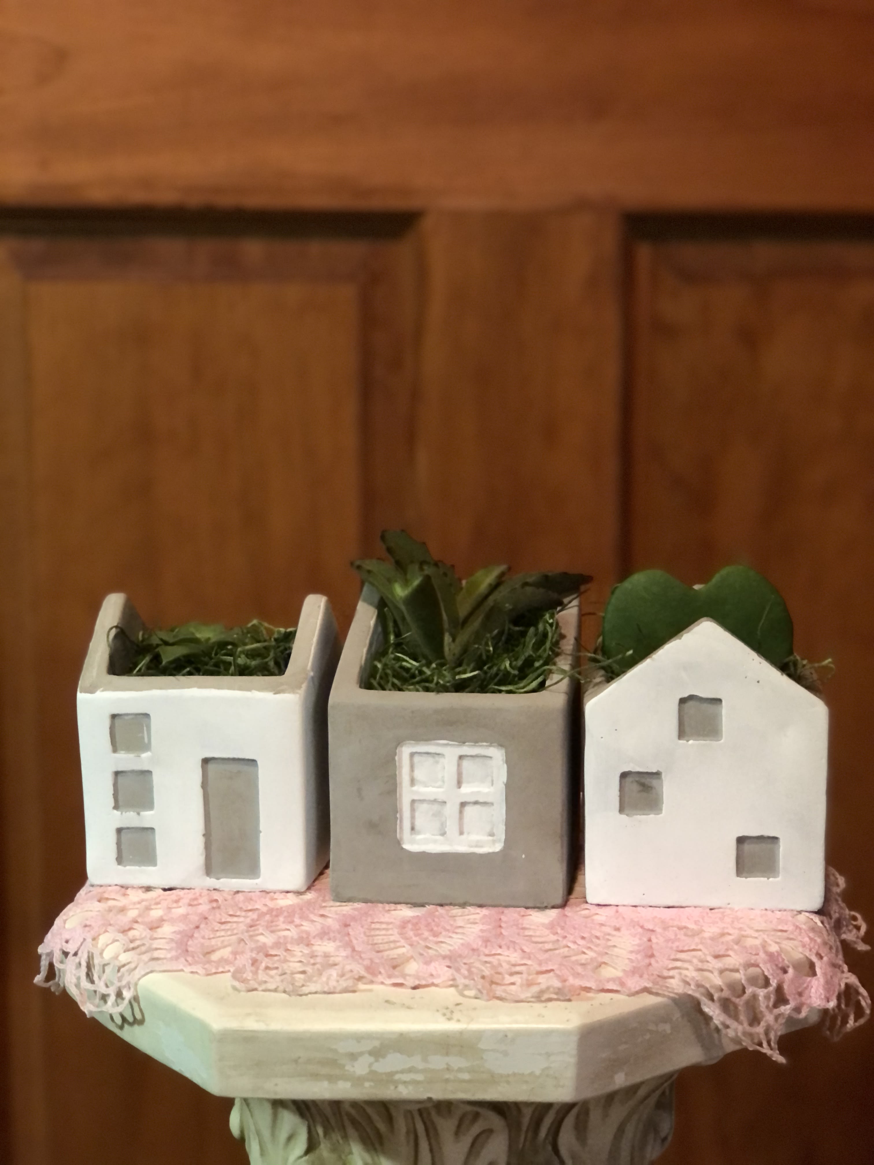 Stone Cottage Village - Natural hand-thrown earthenware clay for a durable and substantial container.  3 containers, separately placed together to form a little village. Can be placed together or apart. Glazed with 3 different patterns of cottage door &amp; windows on one side. The cottage provide the perfect container for our mini succulents. ( each container has 1 succulent.) Container is filled with succulent potting soil and sand. Fertilizer is also layered with the soil mix to provide a year or more of plant growth until you may need to re-pot your plants. Inventory count: 2 remaining. (succulents may vary by season.)