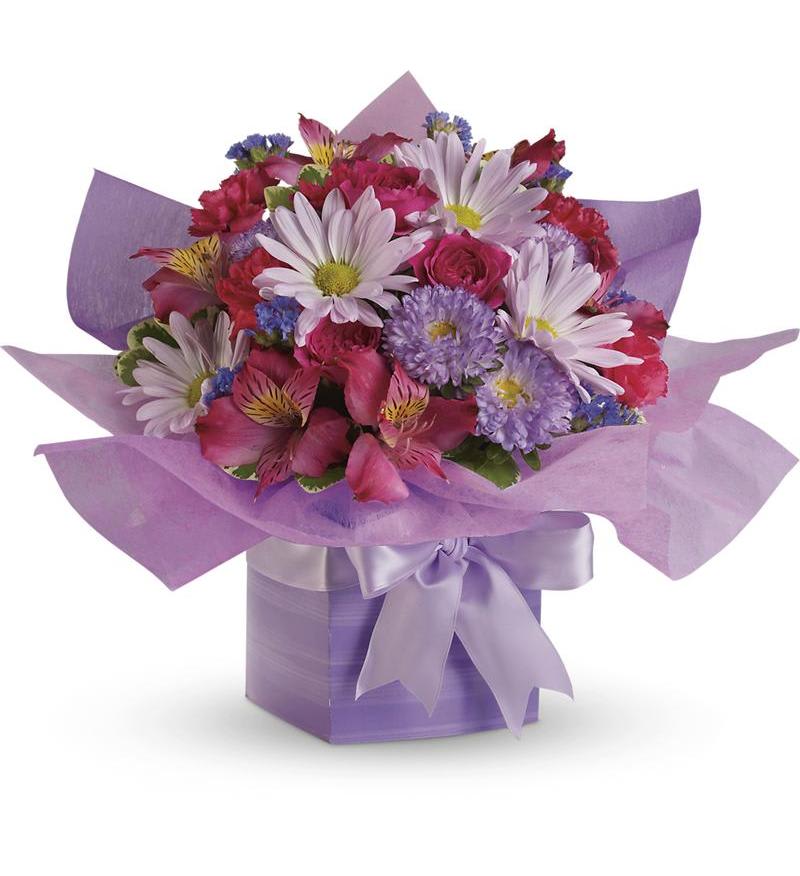 Lavender present Lavender present - A birthday surprise she won't soon forget! This fabulously feminine gift combines soft shades of lavender and pink into a pretty purple gift box. Diaphanous tissue paper and a satin bow add up to birthday present perfection!