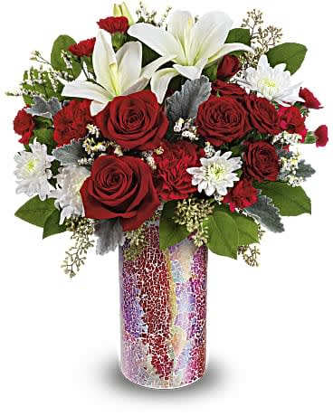 Teleflora's Love Sparkles Bouquet - Your love truly sparkles for all to see with this breathtaking red rose bouquet in a vibrant mosaic glass vase. Red roses, red spray roses, white asiatic lilies, red carnations, miniature red carnations, white cushion spray chrysanthemums and white limonium are arranged with dusty miller, seeded eucalyptus and lemon leaf. Delivered in Teleflora's Love Sparkles vase. Orientation: All-Around
