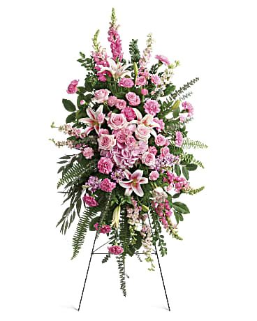 Glorious Farewell Spray - Glorify a life well-lived with this magnificent spray of pink hydrangea, roses and lilies--a radiant, reflective celebration of her beauty and love. This glorious spray includes pink hydrangea, light pink roses, light pink spray roses, pink oriental lilies, pink carnations, miniature light pink carnations, pink larkspur, pink snapdragons, pink stock, huckleberry, sword fern, asparagus plumosus and greenery. Delivered on a wire easel. Orientation: N/A