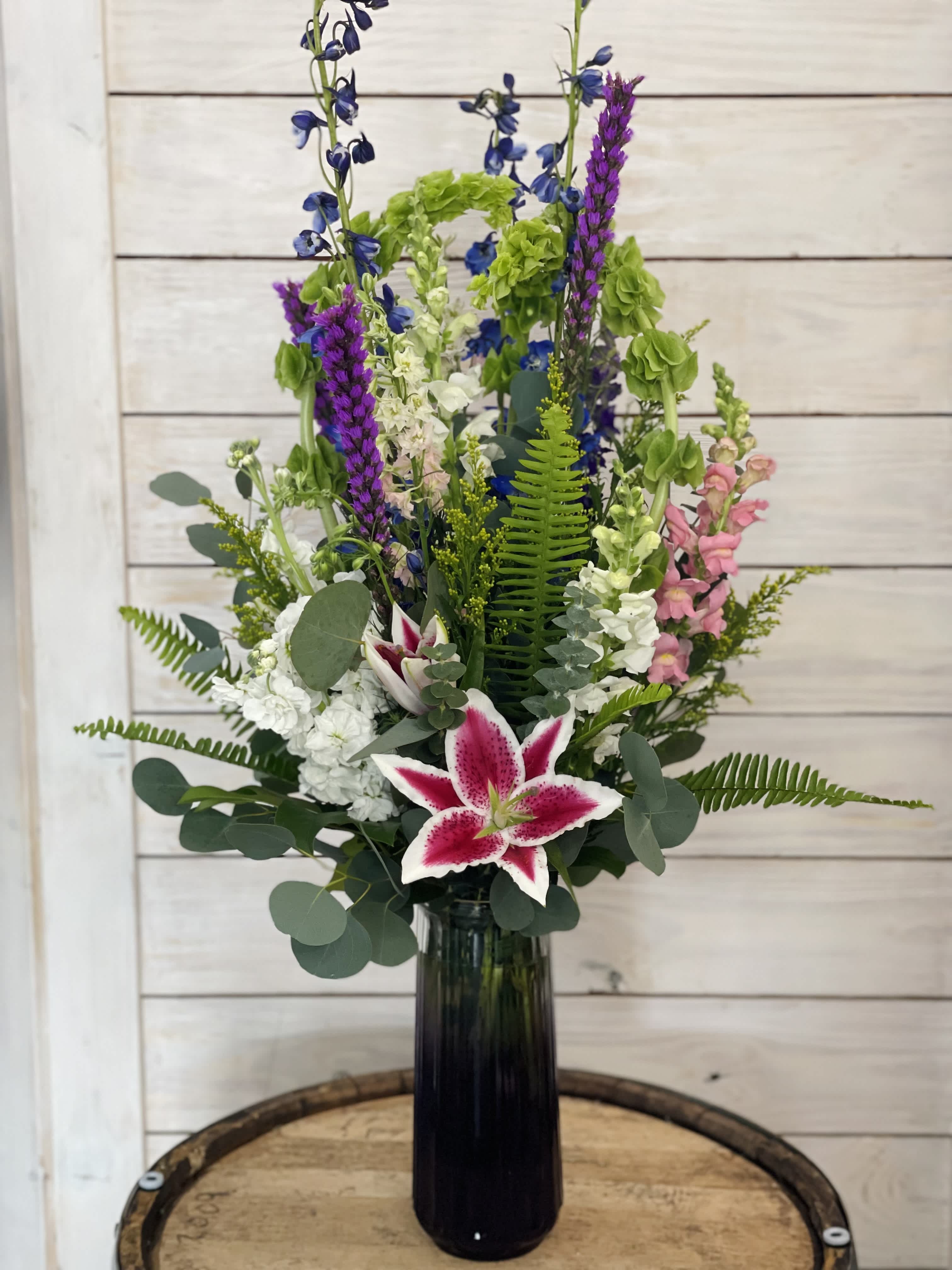 Grandiose, Divine and Magnificent - Standing at nearly 40 inches tall this grand arrangement is the perfect show stopping, garden loving piece for your favorite Valentine! Filled with a variety of flowers known to grow tall, don't stare up too long or you could get a crick in your neck. 