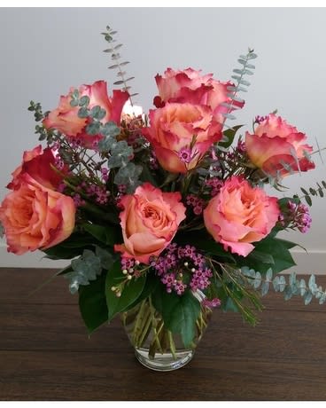 Give the Gift of Free Spirit - Half Dozen - A half dozen of our gorgeous Free Spirit roses, arranged in a vase with greens and waxflower.