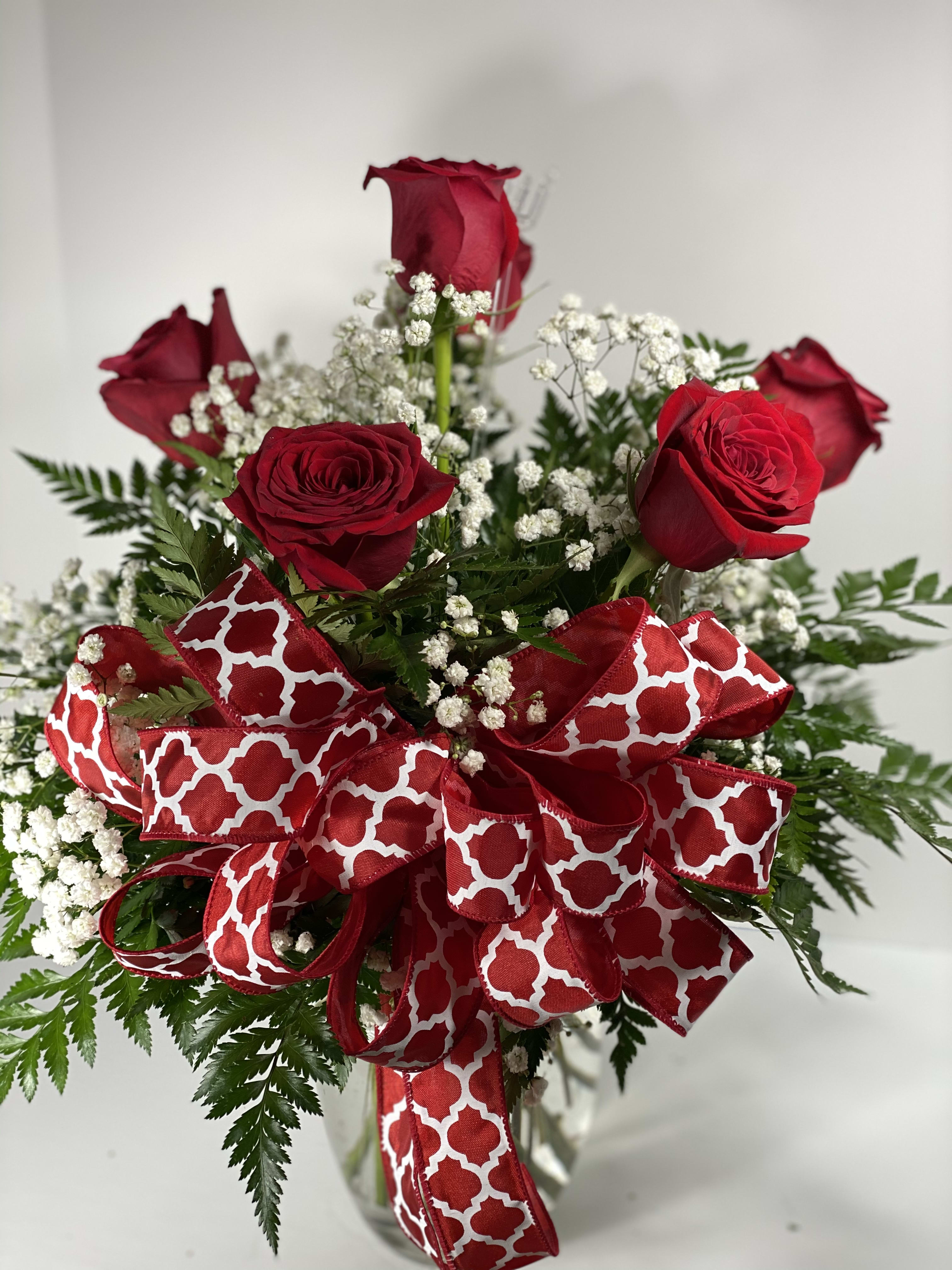 1/2 Dozen Long Stem Red Roses - Brighten any celebration with a beautiful and brilliant bouquet of premium long-stem red roses. Hand-designed, it's a stylish and vibrant gift that's sure to bring smiles to their day. Our florists select only the finest, freshest long-stem red roses and arrange them by hand with fresh gypsophila in a classic glass vase.