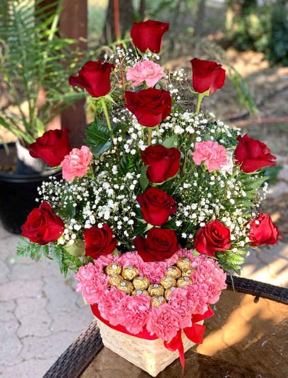 Heart is mine - This single-sided basket consists of pink carnations arranged into a heart shape, accompanied by delicious Ferrero chocolates. Add a crown in our “add on” section! *If you need further information, please feel free to contact us (650-885-6421) we offer service for all special needs *some seasonal flowers &amp; vases subjected to change based on the season &amp; availability .