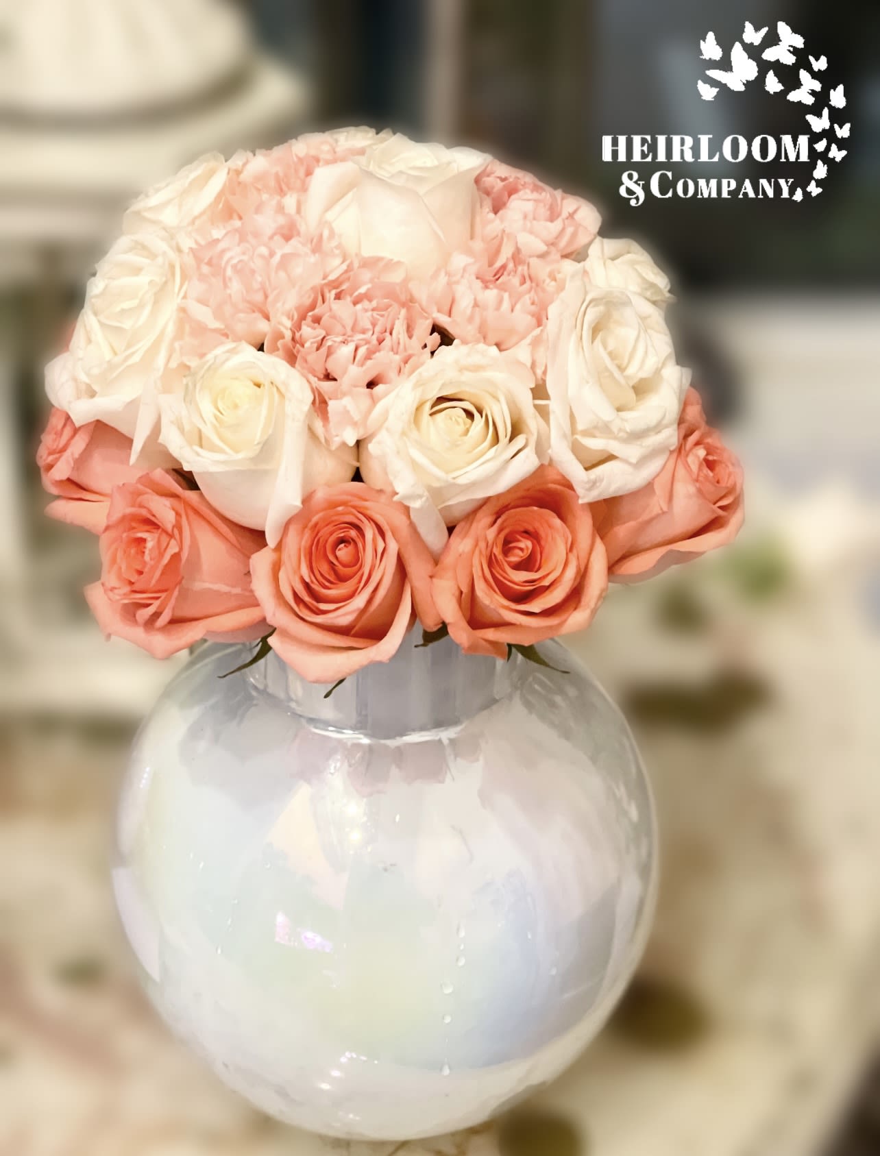 Buttercup - An adorable iridescent bubble vase with a mixture of pink and ivory roses!