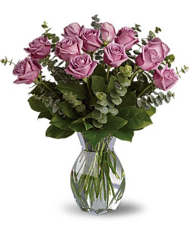 Lavender Wishes - Dozen Premium Lavender Roses - Lovely lavender roses are enchanting and exotic. They can even signify love at first sight and when this pretty bouquet is delivered it will surely be love. Gorgeous as the roses are by themselves when mixed with the dark forest green of eucalyptus the effect is intoxicating.