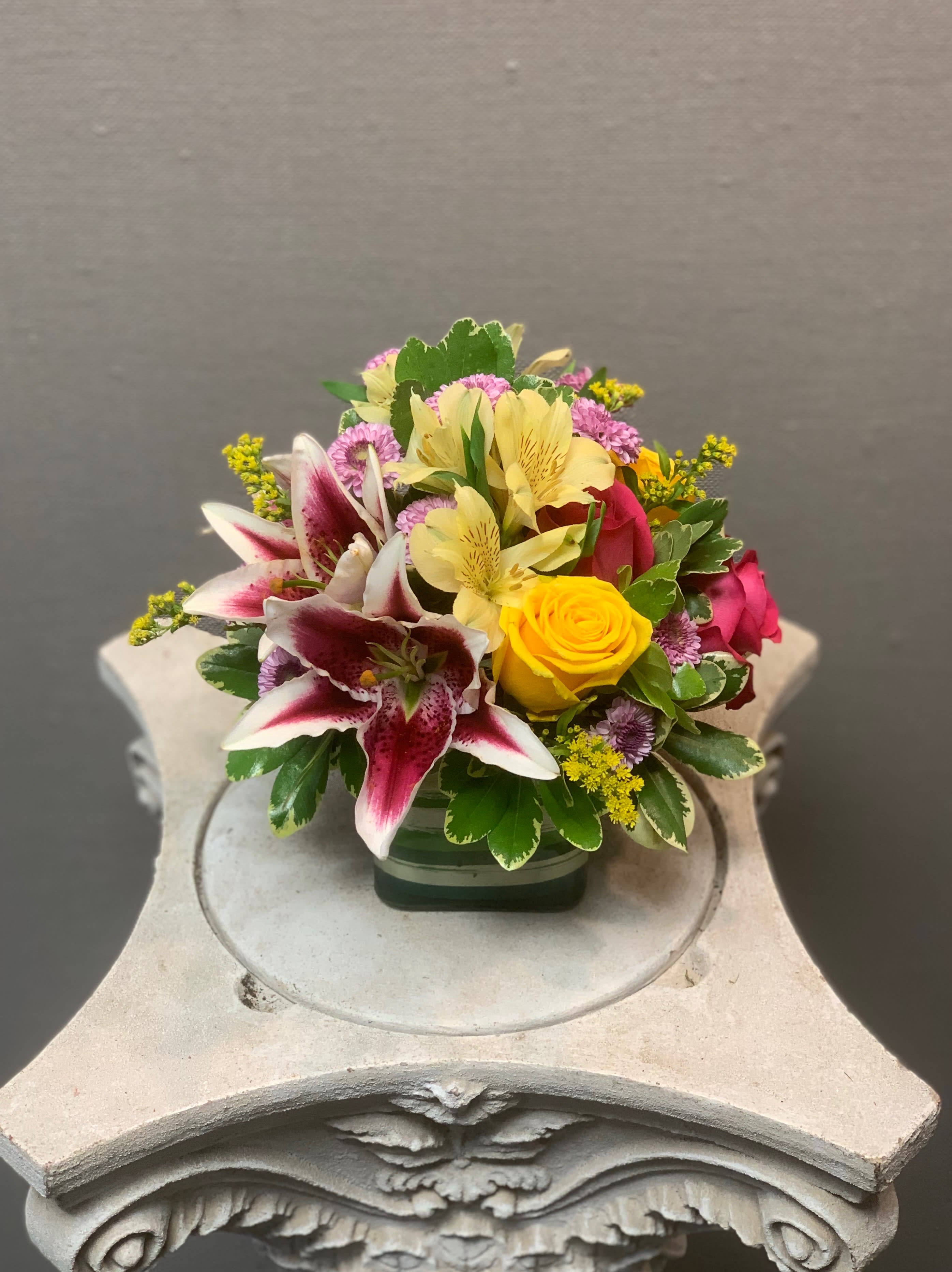 Say it Best! - This bouquet is a unique combo arranged in a glass cube that will help you celebrate your occasion best!