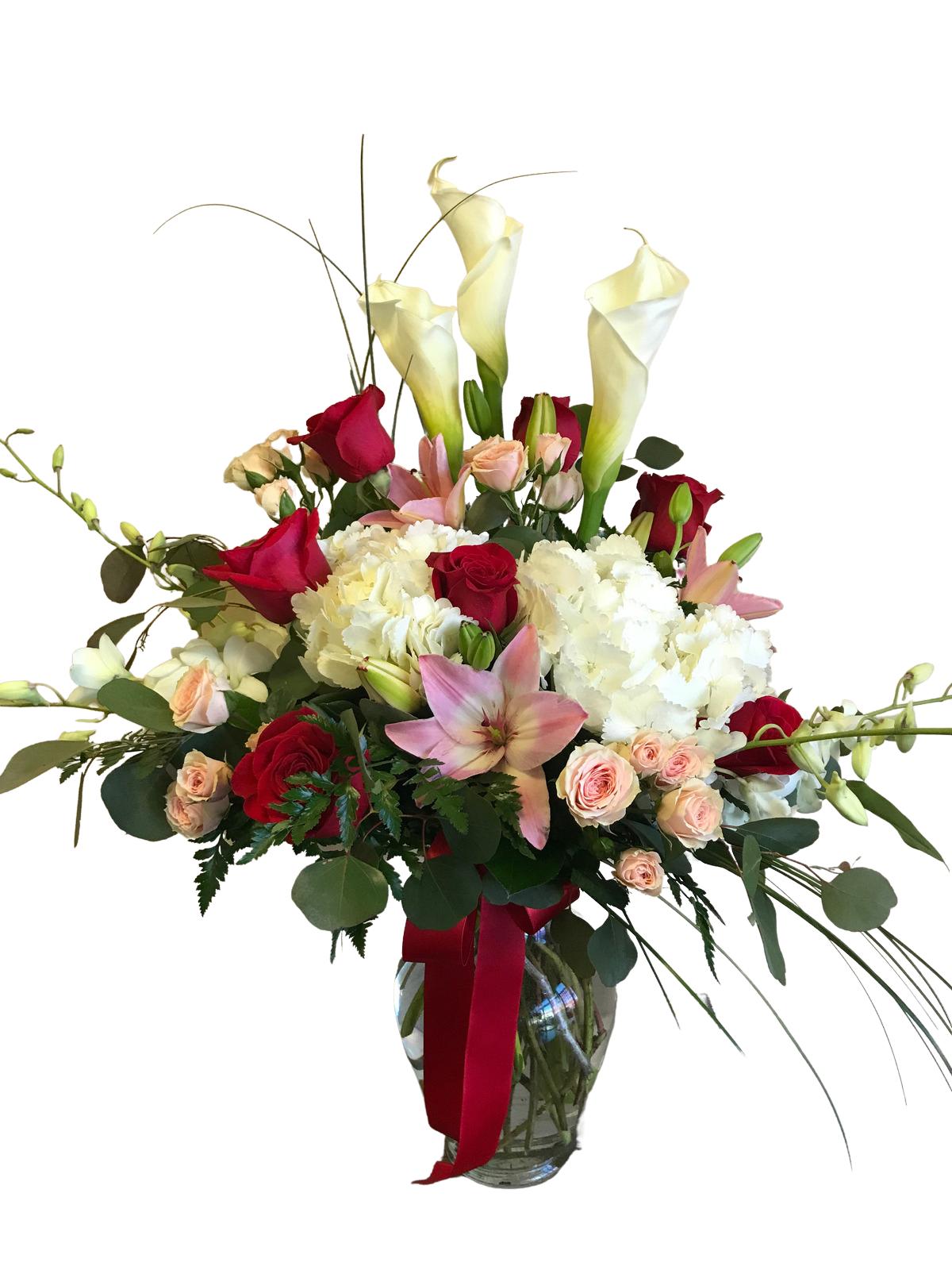 Endless Love - Calla Lilies, Hydrangea, Orchids, Lilies, Roses and Spray Roses in a glass vase with a variety of specialty greenery