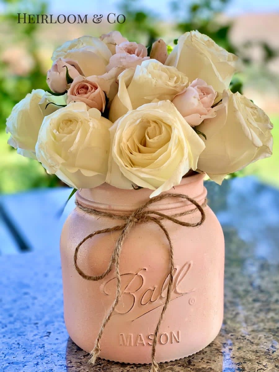 Farmhouse Lovely Farmhouse Lovely - Presented in a giant, over-sized mason jar filled with premium, hand-picked, ivory garden roses. These exquisite fresh blooms will fill any home with a beautiful aroma.