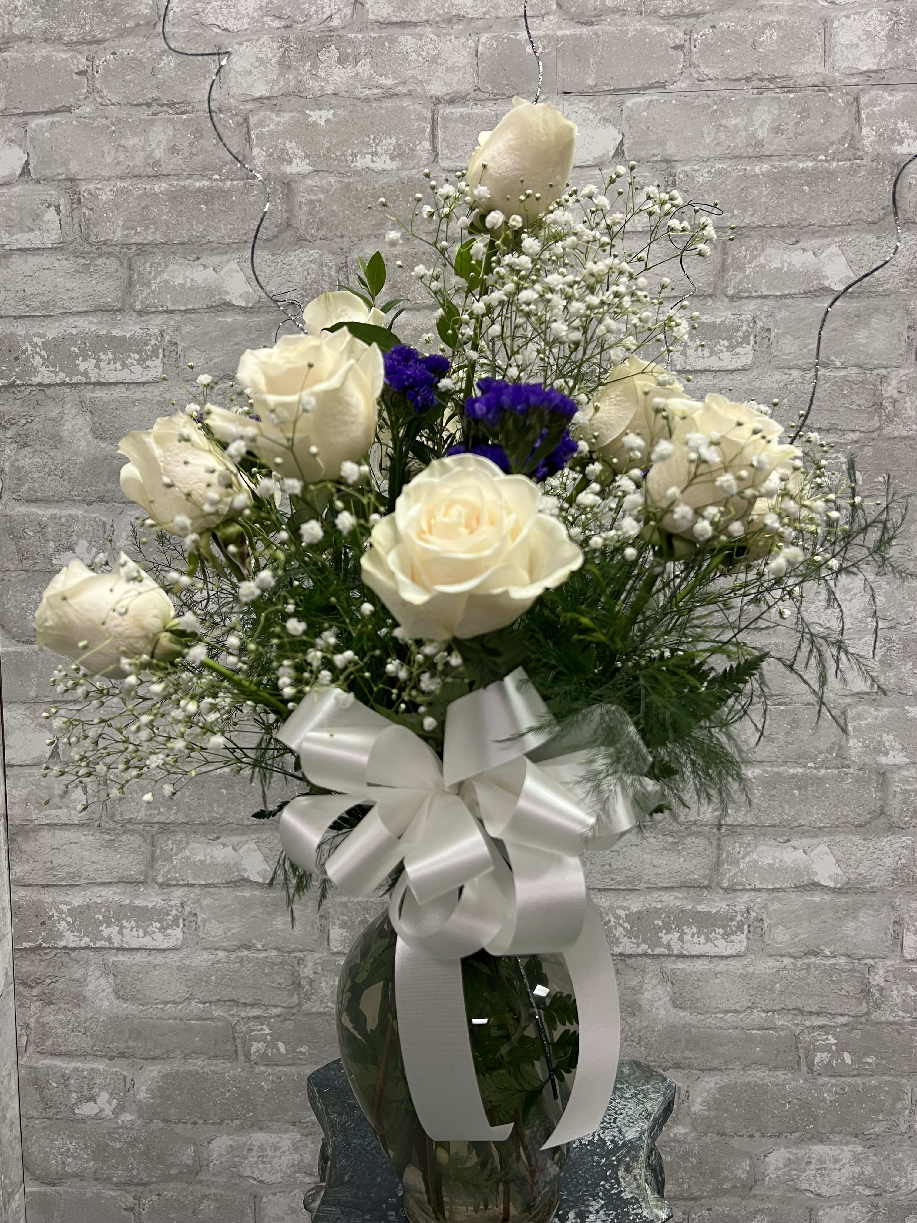 Bensalem Best Dozen Roses White  - Twelve premium long stemmed roses designed in an attractive vase and accented with pretty bow and sparkling ting to finish the &quot;WOW&quot; effect. Deluxe includes premium foliage. Premium includes premium foliage and premium accent flowers. 27&quot; H x 21&quot; W